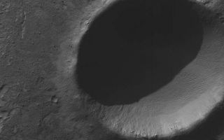 <h1>PIA07202:  Pedestal Crater</h1><div class="PIA07202" lang="en" style="width:591px;text-align:left;margin:auto;background-color:#000;padding:10px;max-height:150px;overflow:auto;"><p>5 January 2004<br ><p>This Mars Global Surveyor (MGS) Mars Orbiter Camera (MOC) image shows an impact crater, a little over 2 km (> 1.2 mi) in diameter, located in Noachis Terra near 50.4°S, 14.3°W. The crater's bouldery ejecta blanket has protected underlying material from being eroded away by wind, leaving the ejecta up on a low pedestal. This picture covers an area about 3 km (1.9 mi) across, and is illuminated by sunlight from the upper left.</p><br /><br /><a href="http://photojournal.jpl.nasa.gov/catalog/PIA07202" onclick="window.open(this.href); return false;" title="Voir l'image 	 PIA07202:  Pedestal Crater	  sur le site de la NASA">Voir l'image 	 PIA07202:  Pedestal Crater	  sur le site de la NASA.</a></div>