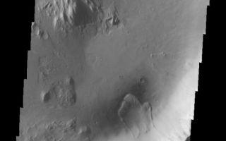 <h1>PIA07285:  Landslide in a Crater</h1><div class="PIA07285" lang="en" style="width:615px;text-align:left;margin:auto;background-color:#000;padding:10px;max-height:150px;overflow:auto;"><p><a href="/figures/PIA07285_fig1.jpg"> </a><br /><p>The landslide in this VIS image is located inside an impact crater in the Elysium region of Mars. The unnamed crater is located at the margin of the volcanic flows from the Elysium Mons complex.</p><p>Image information: VIS instrument. Latitude 1.2, Longitude 134 East (226 West). 19 meter/pixel resolution.</p><p>Note: this THEMIS visual image has not been radiometrically nor geometrically calibrated for this preliminary release. An empirical correction has been performed to remove instrumental effects. A linear shift has been applied in the cross-track and down-track direction to approximate spacecraft and planetary motion. Fully calibrated and geometrically projected images will be released through the Planetary Data System in accordance with Project policies at a later time.</p><p>NASA's Jet Propulsion Laboratory manages the 2001 Mars Odyssey mission for NASA's Office of Space Science, Washington, D.C. The Thermal Emission Imaging System (THEMIS) was developed by Arizona State University, Tempe, in collaboration with Raytheon Santa Barbara Remote Sensing. The THEMIS investigation is led by Dr. Philip Christensen at Arizona State University. Lockheed Martin Astronautics, Denver, is the prime contractor for the Odyssey project, and developed and built the orbiter. Mission operations are conducted jointly from Lockheed Martin and from JPL, a division of the California Institute of Technology in Pasadena.</p><br /><br /><a href="http://photojournal.jpl.nasa.gov/catalog/PIA07285" onclick="window.open(this.href); return false;" title="Voir l'image 	 PIA07285:  Landslide in a Crater	  sur le site de la NASA">Voir l'image 	 PIA07285:  Landslide in a Crater	  sur le site de la NASA.</a></div>