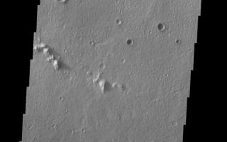 <h1>PIA07287:  Isidis Crater Landslide</h1><div class="PIA07287" lang="en" style="width:558px;text-align:left;margin:auto;background-color:#000;padding:10px;max-height:150px;overflow:auto;"><p><a href="/figures/PIA07287_fig1.jpg"> </a><br /><p>The landslide in this VIS image is located inside an impact crater located south of the Isidis Planitia region of Mars. As with the previous unnamed crater landslide, this one formed due to slope failure of the inner crater rim.</p><p>Image information: VIS instrument. Latitude -2.9, Longitude 90.8 East (269.2 West). 19 meter/pixel resolution.</p><p>Note: this THEMIS visual image has not been radiometrically nor geometrically calibrated for this preliminary release. An empirical correction has been performed to remove instrumental effects. A linear shift has been applied in the cross-track and down-track direction to approximate spacecraft and planetary motion. Fully calibrated and geometrically projected images will be released through the Planetary Data System in accordance with Project policies at a later time.</p><p>NASA's Jet Propulsion Laboratory manages the 2001 Mars Odyssey mission for NASA's Office of Space Science, Washington, D.C. The Thermal Emission Imaging System (THEMIS) was developed by Arizona State University, Tempe, in collaboration with Raytheon Santa Barbara Remote Sensing. The THEMIS investigation is led by Dr. Philip Christensen at Arizona State University. Lockheed Martin Astronautics, Denver, is the prime contractor for the Odyssey project, and developed and built the orbiter. Mission operations are conducted jointly from Lockheed Martin and from JPL, a division of the California Institute of Technology in Pasadena.</p><br /><br /><a href="http://photojournal.jpl.nasa.gov/catalog/PIA07287" onclick="window.open(this.href); return false;" title="Voir l'image 	 PIA07287:  Isidis Crater Landslide	  sur le site de la NASA">Voir l'image 	 PIA07287:  Isidis Crater Landslide	  sur le site de la NASA.</a></div>