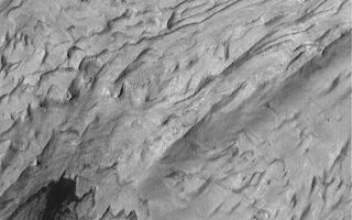 <h1>PIA07293:  Becquerel's Sediment</h1><div class="PIA07293" lang="en" style="width:551px;text-align:left;margin:auto;background-color:#000;padding:10px;max-height:150px;overflow:auto;"><p>21 January 2004<br >This Mars Global Surveyor (MGS) Mars Orbiter Camera (MOC) image shows light-toned, layered, sedimentary rock outcrops in south-central Becquerel Crater in western Arabia Terra near 21.3°N, 8.4°W. The layered material may have been deposited in an intracrater lake, early in martian history. The material has subsequently been exposed and eroded by wind. Dark sand dunes have accumulated along the southern margin (bottom of image) of the outcrop exposure. The image covers an area about 3 km (1.9 mi) wide and is illuminated by sunlight from the left/lower left.</p><br /><br /><a href="http://photojournal.jpl.nasa.gov/catalog/PIA07293" onclick="window.open(this.href); return false;" title="Voir l'image 	 PIA07293:  Becquerel's Sediment	  sur le site de la NASA">Voir l'image 	 PIA07293:  Becquerel's Sediment	  sur le site de la NASA.</a></div>