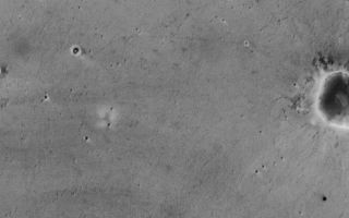 <h1>PIA07295:  Opportunity Tracks Seen from Orbit</h1><div class="PIA07295" lang="en" style="width:800px;text-align:left;margin:auto;background-color:#000;padding:10px;max-height:150px;overflow:auto;"><p><a href="/figures/PIA07295_fig1.jpg"></a><br>Figure 1</p><p>NASA's Mars Exploration Rover Opportunity landed on the red planet a year ago. This enhanced-resolution image from the Mars Orbiter Camera on NASA's Mars Global Surveyor orbiter is the only picture obtained thus far (by Jan. 24, 2005) that shows the tracks made by Opportunity. </p><p>The image was acquired on April 26, 2004, during Opportunity's 91st martian day, or sol. That was the first day of Opportunity's extended mission, and the rover had recently completed exploration of small "Fram Crater" on the route from its landing site toward "Endurance Crater," where it would eventually spend six months. The rover itself can be seen in this image -- an amazing accomplishment, considering that the orbiter was nearly 400 kilometers (nearly 250 miles) away at the time! Also visible and labeled on this image are the spacecraft's lander, backshell, parachute and heat shield, plus effects of its landing rockets. </p><p>The camera captured this image with use of a technique called compensated pitch and roll targeted observation. In this method, the entire spacecraft rolls as it passes over the target area so the camera can scan in a way that sees details at three times higher resolution than the camera's normal high-resolution capability. </p><p>The tracks made by Opportunity on the sandy surface of Meridiani Planum are not quite as visible from orbit as are the tracks made in Gusev Crater by the other Mars Exploration Rover, Spirit. A dustier surface at the Spirit site increases contrast between the tracks and the surrounding surfaces. Indeed, some parts of the track made by Opportunity are not visible in this image. Sunlight illuminates the scene from the left. North is toward the top of the image. The 100-meter scale bar is 109 yards long.</p><br /><br /><a href="http://photojournal.jpl.nasa.gov/catalog/PIA07295" onclick="window.open(this.href); return false;" title="Voir l'image 	 PIA07295:  Opportunity Tracks Seen from Orbit	  sur le site de la NASA">Voir l'image 	 PIA07295:  Opportunity Tracks Seen from Orbit	  sur le site de la NASA.</a></div>