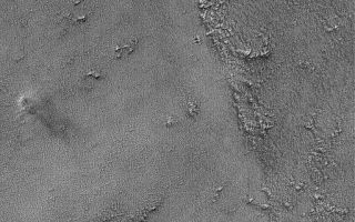 <h1>PIA07339:  Syrian Dust Devil</h1><div class="PIA07339" lang="en" style="width:512px;text-align:left;margin:auto;background-color:#000;padding:10px;max-height:150px;overflow:auto;"><p>This Mars Global Surveyor (MGS) Mars Orbiter Camera (MOC) image shows a dust devil in far western Syria Planum. The dust devil is located near the left-center of the image. It is casting a shadow toward the lower right (southeast).<p>Location near: 14.5°S, 109.6°W <br .>Image width: ~3 km (~1.9 mi) <br .>Illumination from: upper left <br .>Season: Southern Winter<br .></p><br /><br /><a href="http://photojournal.jpl.nasa.gov/catalog/PIA07339" onclick="window.open(this.href); return false;" title="Voir l'image 	 PIA07339:  Syrian Dust Devil	  sur le site de la NASA">Voir l'image 	 PIA07339:  Syrian Dust Devil	  sur le site de la NASA.</a></div>