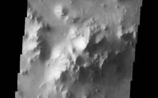 <h1>PIA07451:  Isidis Planitia Central Peak</h1><div class="PIA07451" lang="en" style="width:523px;text-align:left;margin:auto;background-color:#000;padding:10px;max-height:150px;overflow:auto;"><a href="/figures/PIA07451_fig1.jpg"></a><br /><p>The topic for the Image of the Day for the weeks of March 7-18 will be mountains on Mars.</p><p>This is an image of a substantial central peak on the floor of a larger crater in Isidis Planitia.</p><p>A good diagram showing the structural difference between simple and complex craters is here: <a href="http://www.lpi.usra.edu/expmoon/science/craterstructure.html">http://www.lpi.usra.edu/expmoon/science/craterstructure.html</a></p>Image information: VIS instrument. Latitude 5.4 Longitude 93.6 East (266.4 West). 19 meter/pixel resolution.</p><p>Note: this THEMIS visual image has not been radiometrically nor geometrically calibrated for this preliminary release. An empirical correction has been performed to remove instrumental effects. A linear shift has been applied in the cross-track and down-track direction to approximate spacecraft and planetary motion. Fully calibrated and geometrically projected images will be released through the Planetary Data System in accordance with Project policies at a later time.</p><p>NASA's Jet Propulsion Laboratory manages the 2001 Mars Odyssey mission for NASA's Office of Space Science, Washington, D.C. The Thermal Emission Imaging System (THEMIS) was developed by Arizona State University, Tempe, in collaboration with Raytheon Santa Barbara Remote Sensing. The THEMIS investigation is led by Dr. Philip Christensen at Arizona State University. Lockheed Martin Astronautics, Denver, is the prime contractor for the Odyssey project, and developed and built the orbiter. Mission operations are conducted jointly from Lockheed Martin and from JPL, a division of the California Institute of Technology in Pasadena.</p><br /><br /><a href="http://photojournal.jpl.nasa.gov/catalog/PIA07451" onclick="window.open(this.href); return false;" title="Voir l'image 	 PIA07451:  Isidis Planitia Central Peak	  sur le site de la NASA">Voir l'image 	 PIA07451:  Isidis Planitia Central Peak	  sur le site de la NASA.</a></div>