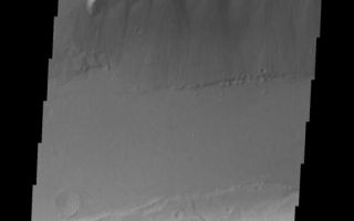 <h1>PIA07455:  Mensa in Kasei Vallis</h1><div class="PIA07455" lang="en" style="width:545px;text-align:left;margin:auto;background-color:#000;padding:10px;max-height:150px;overflow:auto;"><a href="/figures/PIA07455_fig1.jpg"></a><br /><p>The topic for the Image of the Day for the weeks of March 7-18 will be mountains on Mars.</p><p>This image is located in Kasei Vallis and contains a a feature type called a Mensa, from the Latin word for 'table.' A Mensa is a flat-topped prominence with cliff-like edges.</p><p>A good diagram showing the structural difference between simple and complex craters is here: <a href="http://www.lpi.usra.edu/expmoon/science/craterstructure.html">http://www.lpi.usra.edu/expmoon/science/craterstructure.html</a></p>Image information: VIS instrument. Latitude 22.6, Longitude 293.9 East (66.1 West). 19 meter/pixel resolution.</p><p>Note: this THEMIS visual image has not been radiometrically nor geometrically calibrated for this preliminary release. An empirical correction has been performed to remove instrumental effects. A linear shift has been applied in the cross-track and down-track direction to approximate spacecraft and planetary motion. Fully calibrated and geometrically projected images will be released through the Planetary Data System in accordance with Project policies at a later time.</p><p>NASA's Jet Propulsion Laboratory manages the 2001 Mars Odyssey mission for NASA's Office of Space Science, Washington, D.C. The Thermal Emission Imaging System (THEMIS) was developed by Arizona State University, Tempe, in collaboration with Raytheon Santa Barbara Remote Sensing. The THEMIS investigation is led by Dr. Philip Christensen at Arizona State University. Lockheed Martin Astronautics, Denver, is the prime contractor for the Odyssey project, and developed and built the orbiter. Mission operations are conducted jointly from Lockheed Martin and from JPL, a division of the California Institute of Technology in Pasadena.</p><br /><br /><a href="http://photojournal.jpl.nasa.gov/catalog/PIA07455" onclick="window.open(this.href); return false;" title="Voir l'image 	 PIA07455:  Mensa in Kasei Vallis	  sur le site de la NASA">Voir l'image 	 PIA07455:  Mensa in Kasei Vallis	  sur le site de la NASA.</a></div>