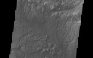 <h1>PIA07488:  Candor Chasma Chaos</h1><div class="PIA07488" lang="en" style="width:519px;text-align:left;margin:auto;background-color:#000;padding:10px;max-height:150px;overflow:auto;"><a href="/figures/PIA07488_fig1.jpg"></a><br /><p>The topic for the Image of the Day for the weeks of March 7-18 will be mountains on Mars.</p><p>This is some chaos terrain located on the floor of Candor Chasma. Chaos is typically interpreted to be a collapse terrain; it is the blocky landscape after the transport and removal of subsurface support.</p><p>A good diagram showing the structural difference between simple and complex craters is here: <a href="http://www.lpi.usra.edu/expmoon/science/craterstructure.html">http://www.lpi.usra.edu/expmoon/science/craterstructure.html</a></p>Image information: VIS instrument. Latitude -6.7, Longitude 287.7 East (72.3 West). 19 meter/pixel resolution.</p><p>Note: this THEMIS visual image has not been radiometrically nor geometrically calibrated for this preliminary release. An empirical correction has been performed to remove instrumental effects. A linear shift has been applied in the cross-track and down-track direction to approximate spacecraft and planetary motion. Fully calibrated and geometrically projected images will be released through the Planetary Data System in accordance with Project policies at a later time.</p><p>NASA's Jet Propulsion Laboratory manages the 2001 Mars Odyssey mission for NASA's Office of Space Science, Washington, D.C. The Thermal Emission Imaging System (THEMIS) was developed by Arizona State University, Tempe, in collaboration with Raytheon Santa Barbara Remote Sensing. The THEMIS investigation is led by Dr. Philip Christensen at Arizona State University. Lockheed Martin Astronautics, Denver, is the prime contractor for the Odyssey project, and developed and built the orbiter. Mission operations are conducted jointly from Lockheed Martin and from JPL, a division of the California Institute of Technology in Pasadena.</p><br /><br /><a href="http://photojournal.jpl.nasa.gov/catalog/PIA07488" onclick="window.open(this.href); return false;" title="Voir l'image 	 PIA07488:  Candor Chasma Chaos	  sur le site de la NASA">Voir l'image 	 PIA07488:  Candor Chasma Chaos	  sur le site de la NASA.</a></div>