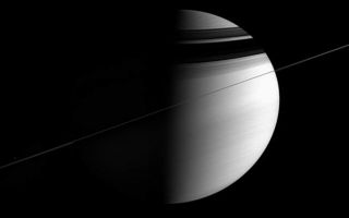 <h1>PIA07676:  Slightly Sideways Saturn</h1><div class="PIA07676" lang="en" style="width:800px;text-align:left;margin:auto;background-color:#000;padding:10px;max-height:150px;overflow:auto;"><p>As the ringed giant tugged on the Cassini spacecraft, urging it to make yet another orbit, the intrepid spacecraft took in this all-encompassing panorama. This view was acquired near apoapse -- the farthest point from Saturn in the Cassini spacecraft's elliptical orbit. Even from this distant vantage point, the planet and its rings were still too large to fit into a single frame; this view is a mosaic of two images.</p><p>The rings are the source of the dark, curving shadows on the northern hemisphere. Mimas (397 kilometers, or 247 miles across) is visible as a speck of light just above the rings at left.</p><p>The image was taken in visible light with the Cassini spacecraft wide-angle camera on Dec. 12, 2005, at a distance of approximately 3.2 million kilometers (2 million miles) from Saturn and at a Sun-Saturn-spacecraft, or phase, angle of 87 degrees. The image scale is 193 kilometers (120 miles) per pixel.</p><p>The Cassini-Huygens mission is a cooperative project of NASA, the European Space Agency and the Italian Space Agency. The Jet Propulsion Laboratory, a division of the California Institute of Technology in Pasadena, manages the mission for NASA's Science Mission Directorate, Washington, D.C. The Cassini orbiter and its two onboard cameras were designed, developed and assembled at JPL. The imaging operations center is based at the Space Science Institute in Boulder, Colo.</p><p>For more information about the Cassini-Huygens mission visit <a href="http://saturn.jpl.nasa.gov">http://saturn.jpl.nasa.gov</a>. The Cassini imaging team homepage is at <a href="http://ciclops.org">http://ciclops.org</a>.</p><br /><br /><a href="http://photojournal.jpl.nasa.gov/catalog/PIA07676" onclick="window.open(this.href); return false;" title="Voir l'image 	 PIA07676:  Slightly Sideways Saturn	  sur le site de la NASA">Voir l'image 	 PIA07676:  Slightly Sideways Saturn	  sur le site de la NASA.</a></div>