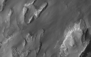 <h1>PIA07840:  Gale Sedimentary Rocks</h1><div class="PIA07840" lang="en" style="width:628px;text-align:left;margin:auto;background-color:#000;padding:10px;max-height:150px;overflow:auto;"><p>15 April 2005 <br />This Mars Global Surveyor (MGS) Mars Orbiter Camera (MOC) image shows outcroppings of layered, sedimentary rock in eastern Gale Crater. North-central Gale Crater is the site of a mound that is more than several kilometers thick and largely composed of sedimentary rocks that record a complex history of deposition and erosion. At one time, Gale Crater might have been completely filled and buried beneath the martian surface.</p><p>Location near: 4.9°S, 221.6°W <br />Image width: ~3 km (~1.9 mi) <br />Illumination from: upper left <br />Season: Southern Winter <br /></p><br /><br /><a href="http://photojournal.jpl.nasa.gov/catalog/PIA07840" onclick="window.open(this.href); return false;" title="Voir l'image 	 PIA07840:  Gale Sedimentary Rocks	  sur le site de la NASA">Voir l'image 	 PIA07840:  Gale Sedimentary Rocks	  sur le site de la NASA.</a></div>