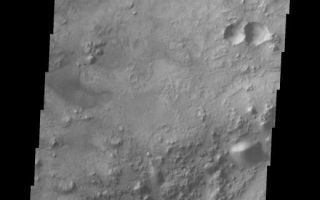 <h1>PIA07845:  Crater Floor Dune Field</h1><div class="PIA07845" lang="en" style="width:520px;text-align:left;margin:auto;background-color:#000;padding:10px;max-height:150px;overflow:auto;"><a href="/figures/PIA07845_fig1.jpg"></a><br /><p>Our topic for the weeks of April 4 and April 11 is dunes on Mars. We will look at the north polar sand sea and at isolated dune fields at lower latitudes. Sand seas on Earth are often called "ergs," an Arabic name for dune field. A sand sea differs from a dune field in two ways: 1) a sand sea has a large regional extent, and 2) the individual dunes are large in size and complex in form.</p><p>Our final dune image shows a small dune field inside an unnamed crater south of Nili Fossae.</p><p>Image information: VIS instrument. Latitude 20.6, Longitude 79 East (281 West). 19 meter/pixel resolution.</p><p>Note: this THEMIS visual image has not been radiometrically nor geometrically calibrated for this preliminary release. An empirical correction has been performed to remove instrumental effects. A linear shift has been applied in the cross-track and down-track direction to approximate spacecraft and planetary motion. Fully calibrated and geometrically projected images will be released through the Planetary Data System in accordance with Project policies at a later time.</p><p>NASA's Jet Propulsion Laboratory manages the 2001 Mars Odyssey mission for NASA's Office of Space Science, Washington, D.C. The Thermal Emission Imaging System (THEMIS) was developed by Arizona State University, Tempe, in collaboration with Raytheon Santa Barbara Remote Sensing. The THEMIS investigation is led by Dr. Philip Christensen at Arizona State University. Lockheed Martin Astronautics, Denver, is the prime contractor for the Odyssey project, and developed and built the orbiter. Mission operations are conducted jointly from Lockheed Martin and from JPL, a division of the California Institute of Technology in Pasadena.</p><br /><br /><a href="http://photojournal.jpl.nasa.gov/catalog/PIA07845" onclick="window.open(this.href); return false;" title="Voir l'image 	 PIA07845:  Crater Floor Dune Field	  sur le site de la NASA">Voir l'image 	 PIA07845:  Crater Floor Dune Field	  sur le site de la NASA.</a></div>
