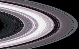 <h1>PIA07872:  Small Particles in Saturns Rings</h1><div class="PIA07872" lang="en" style="width:800px;text-align:left;margin:auto;background-color:#000;padding:10px;max-height:150px;overflow:auto;"><p>Specially designed Cassini orbits place Earth and Cassini on opposite sides of Saturn's rings, a geometry known as occultation. Cassini conducted the first radio occultation observation of Saturn's rings on May 3, 2005. </p><p>Three simultaneous radio signals of 0.94, 3.6, and 13 centimeter wavelengths (Ka-, X-, and S-bands) were sent from Cassini through the rings to Earth. The observed change of each signal as Cassini moved behind the rings provided a profile of the distribution of ring material as a function of distance from Saturn, or an optical depth profile. </p><p>This simulated image was constructed from the measured optical depth profiles. It depicts the observed ring structure at about 10 kilometers (6 miles) in resolution. Color is used to represent information about ring particle sizes in different regions based on the measured effects of the three radio signals. </p><p>Shades of purple, primarily over most of the inner ring (ring B) and the inner portion of the next ring (ring A), indicate regions where there is a lack of particles less than 5 centimeters (about 2 inches) in diameter. Green and blue shades indicate regions where there are particles of sizes smaller than 5 centimeters (2 inches) and 1 centimeter (less than one third of an inch), respectively, primarily in outer ring A and within most of ring C. From other evidence in the radio observations, all ring regions appear to be populated by a broad range of particle size distribution that extends to boulder sizes (several to many meters or yards across). </p><p>The Cassini-Huygens mission is a cooperative project of NASA, the European Space Agency and the Italian Space Agency. The Jet Propulsion Laboratory, a division of the California Institute of Technology in Pasadena, manages the mission for NASA's Science Mission Directorate, Washington, D.C. The Cassini orbiter was designed, developed and assembled at JPL. The radio science team is based at JPL.</p><p>For more information about the Cassini-Huygens mission visit <a href="http://saturn.jpl.nasa.gov">http://saturn.jpl.nasa.gov</a>. For more information on the radio science team visit <a href="http://saturn.jpl.nasa.gov/spacecraft/instruments-cassini-rss.cfm">http://saturn.jpl.nasa.gov/spacecraft/instruments-cassini-rss.cfm</a>.</p><br /><br /><a href="http://photojournal.jpl.nasa.gov/catalog/PIA07872" onclick="window.open(this.href); return false;" title="Voir l'image 	 PIA07872:  Small Particles in Saturns Rings	  sur le site de la NASA">Voir l'image 	 PIA07872:  Small Particles in Saturns Rings	  sur le site de la NASA.</a></div>