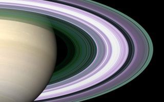 <h1>PIA07873:  Radio Occultation: Unraveling Saturn's Rings</h1><div class="PIA07873" lang="en" style="width:800px;text-align:left;margin:auto;background-color:#000;padding:10px;max-height:150px;overflow:auto;"><p>Specially designed Cassini orbits place Earth and Cassini on opposite sides of Saturn's rings, a geometry known as occultation. Cassini conducted the first radio occultation observation of Saturn's rings on May 3, 2005. </p><p>Three simultaneous radio signals of 0.94, 3.6, and 13 centimeter wavelength (Ka-, X-, and S-bands) were sent from Cassini through the rings to Earth. The observed change of each signal as Cassini moved behind the rings provided a profile of the distribution of ring material as a function of distance from Saturn, or an optical depth profile. </p><p>This simulated image was constructed from the measured optical depth profiles. It depicts the observed ring structure at about 10 kilometers (6 miles) in resolution. Color is used to represent information about ring particle sizes in different regions based on the measured effects of the three radio signals. </p><p>Purple color indicates regions where there is a lack of particles of size less than 5 centimeters (about 2 inches). Green and blue shades indicate regions where there are particles smaller than 5 centimeters (2 inches) and 1 centimeter (less than one third of one inch). The saturated broad white band near the middle of ring B is the densest region of ring B, over which two of the three radio signals were blocked at 10-kilometer (6-mile) resolution, preventing accurate color representation over this band. From other evidence in the radio observations, all ring regions appear to be populated by a broad range particle size distribution that extends to boulder sizes (several to many meters across). </p><p>The Cassini-Huygens mission is a cooperative project of NASA, the European Space Agency and the Italian Space Agency. The Jet Propulsion Laboratory, a division of the California Institute of Technology in Pasadena, manages the mission for NASA's Science Mission Directorate, Washington, D.C. The Cassini orbiter was designed, developed and assembled at JPL. The radio science team is based at JPL.</p><p>For more information about the Cassini-Huygens mission visit <a href="http://saturn.jpl.nasa.gov">http://saturn.jpl.nasa.gov</a>. For more information on the radio science team visit <a href="http://saturn.jpl.nasa.gov/spacecraft/instruments-cassini-rss.cfm">http://saturn.jpl.nasa.gov/spacecraft/instruments-cassini-rss.cfm</a>.</p><br /><br /><a href="http://photojournal.jpl.nasa.gov/catalog/PIA07873" onclick="window.open(this.href); return false;" title="Voir l'image 	 PIA07873:  Radio Occultation: Unraveling Saturn's Rings	  sur le site de la NASA">Voir l'image 	 PIA07873:  Radio Occultation: Unraveling Saturn's Rings	  sur le site de la NASA.</a></div>