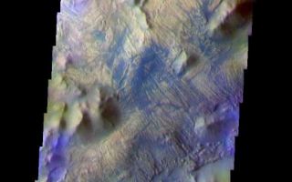 <h1>PIA07918:  Iani Chaos - Another View In False Color</h1><div class="PIA07918" lang="en" style="width:517px;text-align:left;margin:auto;background-color:#000;padding:10px;max-height:150px;overflow:auto;"><a href="/figures/PIA07918_fig1.jpg"></a><br /><p>The THEMIS VIS camera is capable of capturing color images of the Martian surface using five different color filters. In this mode of operation, the spatial resolution and coverage of the image must be reduced to accommodate the additional data volume produced from using multiple filters. To make a color image, three of the five filter images (each in grayscale) are selected. Each is contrast enhanced and then converted to a red, green, or blue intensity image. These three images are then combined to produce a full color, single image. Because the THEMIS color filters don't span the full range of colors seen by the human eye, a color THEMIS image does not represent true color. Also, because each single-filter image is contrast enhanced before inclusion in the three-color image, the apparent color variation of the scene is exaggerated. Nevertheless, the color variation that does appear is representative of some change in color, however subtle, in the actual scene. Note that the long edges of THEMIS color images typically contain color artifacts that do not represent surface variation.</p><p>This false color image is located north of <a href="/catalog/PIA06228">yesterday's image</a>, still within the Iani Chaos. Note the different surface textures within the two images. This image was collected during the Southern Fall season.</p><p>Image information: VIS instrument. Latitude -0.8 Longitude 341.5 East (18.5 West). 36 meter/pixel resolution.</p><p>Note: this THEMIS visual image has not been radiometrically nor geometrically calibrated for this preliminary release. An empirical correction has been performed to remove instrumental effects. A linear shift has been applied in the cross-track and down-track direction to approximate spacecraft and planetary motion. Fully calibrated and geometrically projected images will be released through the Planetary Data System in accordance with Project policies at a later time.</p><p>NASA's Jet Propulsion Laboratory manages the 2001 Mars Odyssey mission for NASA's Office of Space Science, Washington, D.C. The Thermal Emission Imaging System (THEMIS) was developed by Arizona State University, Tempe, in collaboration with Raytheon Santa Barbara Remote Sensing. The THEMIS investigation is led by Dr. Philip Christensen at Arizona State University. Lockheed Martin Astronautics, Denver, is the prime contractor for the Odyssey project, and developed and built the orbiter. Mission operations are conducted jointly from Lockheed Martin and from JPL, a division of the California Institute of Technology in Pasadena.</p><br /><br /><a href="http://photojournal.jpl.nasa.gov/catalog/PIA07918" onclick="window.open(this.href); return false;" title="Voir l'image 	 PIA07918:  Iani Chaos - Another View In False Color	  sur le site de la NASA">Voir l'image 	 PIA07918:  Iani Chaos - Another View In False Color	  sur le site de la NASA.</a></div>