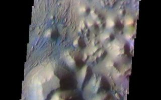 <h1>PIA07919:  Continuing Through Iani Chaos</h1><div class="PIA07919" lang="en" style="width:513px;text-align:left;margin:auto;background-color:#000;padding:10px;max-height:150px;overflow:auto;"><a href="/figures/PIA07919_fig1.jpg"></a><br /><p>The THEMIS VIS camera is capable of capturing color images of the Martian surface using five different color filters. In this mode of operation, the spatial resolution and coverage of the image must be reduced to accommodate the additional data volume produced from using multiple filters. To make a color image, three of the five filter images (each in grayscale) are selected. Each is contrast enhanced and then converted to a red, green, or blue intensity image. These three images are then combined to produce a full color, single image. Because the THEMIS color filters don't span the full range of colors seen by the human eye, a color THEMIS image does not represent true color. Also, because each single-filter image is contrast enhanced before inclusion in the three-color image, the apparent color variation of the scene is exaggerated. Nevertheless, the color variation that does appear is representative of some change in color, however subtle, in the actual scene. Note that the long edges of THEMIS color images typically contain color artifacts that do not represent surface variation.</p><p>This false color image continues the northward trend through the Iani Chaos region. Compare this image to Monday's and Tuesday's. This image was collected during the Southern Fall season.</p><p>Image information: VIS instrument. Latitude -0.1 Longitude 342.6 East (17.4 West). 19 meter/pixel resolution.</p><p>Note: this THEMIS visual image has not been radiometrically nor geometrically calibrated for this preliminary release. An empirical correction has been performed to remove instrumental effects. A linear shift has been applied in the cross-track and down-track direction to approximate spacecraft and planetary motion. Fully calibrated and geometrically projected images will be released through the Planetary Data System in accordance with Project policies at a later time.</p><p>NASA's Jet Propulsion Laboratory manages the 2001 Mars Odyssey mission for NASA's Office of Space Science, Washington, D.C. The Thermal Emission Imaging System (THEMIS) was developed by Arizona State University, Tempe, in collaboration with Raytheon Santa Barbara Remote Sensing. The THEMIS investigation is led by Dr. Philip Christensen at Arizona State University. Lockheed Martin Astronautics, Denver, is the prime contractor for the Odyssey project, and developed and built the orbiter. Mission operations are conducted jointly from Lockheed Martin and from JPL, a division of the California Institute of Technology in Pasadena.</p><br /><br /><a href="http://photojournal.jpl.nasa.gov/catalog/PIA07919" onclick="window.open(this.href); return false;" title="Voir l'image 	 PIA07919:  Continuing Through Iani Chaos	  sur le site de la NASA">Voir l'image 	 PIA07919:  Continuing Through Iani Chaos	  sur le site de la NASA.</a></div>