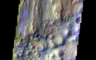<h1>PIA07920:  Ares Vallis/Iani Chaos Border</h1><div class="PIA07920" lang="en" style="width:517px;text-align:left;margin:auto;background-color:#000;padding:10px;max-height:150px;overflow:auto;"><a href="/figures/PIA07920_fig1.jpg"></a><br /><p>The THEMIS VIS camera is capable of capturing color images of the Martian surface using five different color filters. In this mode of operation, the spatial resolution and coverage of the image must be reduced to accommodate the additional data volume produced from using multiple filters. To make a color image, three of the five filter images (each in grayscale) are selected. Each is contrast enhanced and then converted to a red, green, or blue intensity image. These three images are then combined to produce a full color, single image. Because the THEMIS color filters don't span the full range of colors seen by the human eye, a color THEMIS image does not represent true color. Also, because each single-filter image is contrast enhanced before inclusion in the three-color image, the apparent color variation of the scene is exaggerated. Nevertheless, the color variation that does appear is representative of some change in color, however subtle, in the actual scene. Note that the long edges of THEMIS color images typically contain color artifacts that do not represent surface variation.</p><p>This false color image is located in the region where Ares Vallis enters Iani Chaos. Compare the different surface textures in today's image with the previous three images (<a href="/catalog/PIA07919">PIA07919</a>, <a href="/catalog/PIA07918">PIA07918</a>, <a href="/catalog/PIA07917">PIA07917</a>). This image was collected during the Southern Fall season.</p><p>Image information: VIS instrument. Latitude 0.4, Longitude 342.4 East (17.6 West). 36 meter/pixel resolution.</p><p>Note: this THEMIS visual image has not been radiometrically nor geometrically calibrated for this preliminary release. An empirical correction has been performed to remove instrumental effects. A linear shift has been applied in the cross-track and down-track direction to approximate spacecraft and planetary motion. Fully calibrated and geometrically projected images will be released through the Planetary Data System in accordance with Project policies at a later time.</p><p>NASA's Jet Propulsion Laboratory manages the 2001 Mars Odyssey mission for NASA's Office of Space Science, Washington, D.C. The Thermal Emission Imaging System (THEMIS) was developed by Arizona State University, Tempe, in collaboration with Raytheon Santa Barbara Remote Sensing. The THEMIS investigation is led by Dr. Philip Christensen at Arizona State University. Lockheed Martin Astronautics, Denver, is the prime contractor for the Odyssey project, and developed and built the orbiter. Mission operations are conducted jointly from Lockheed Martin and from JPL, a division of the California Institute of Technology in Pasadena.</p><br /><br /><a href="http://photojournal.jpl.nasa.gov/catalog/PIA07920" onclick="window.open(this.href); return false;" title="Voir l'image 	 PIA07920:  Ares Vallis/Iani Chaos Border	  sur le site de la NASA">Voir l'image 	 PIA07920:  Ares Vallis/Iani Chaos Border	  sur le site de la NASA.</a></div>