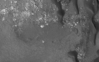 <h1>PIA07935:  Stokes Crater Dunes</h1><div class="PIA07935" lang="en" style="width:512px;text-align:left;margin:auto;background-color:#000;padding:10px;max-height:150px;overflow:auto;"><p>6 May 2005<br />This Mars Global Surveyor (MGS) Mars Orbiter Camera (MOC) image shows dark-toned sand dunes on the floor of Stokes Crater, located on the martian northern plains. The steepest slopes on the dunes indicate the direction of sand transport; the winds responsible for these dunes generally blow from the north/northeast (top/upper right).</p><p>Location near: 55.9°N, 188.6°W <br />Image width: ~3 km (~1.9 mi) <br />Illumination from: lower left <br />Season: Northern Summer <br /></p><br /><br /><a href="http://photojournal.jpl.nasa.gov/catalog/PIA07935" onclick="window.open(this.href); return false;" title="Voir l'image 	 PIA07935:  Stokes Crater Dunes	  sur le site de la NASA">Voir l'image 	 PIA07935:  Stokes Crater Dunes	  sur le site de la NASA.</a></div>