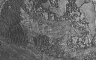 <h1>PIA07951:  Broken Sedimentary Rocks</h1><div class="PIA07951" lang="en" style="width:800px;text-align:left;margin:auto;background-color:#000;padding:10px;max-height:150px;overflow:auto;"><p>18 May 2005<br />This Mars Global Surveyor (MGS) Mars Orbiter Camera (MOC) image shows broken-up blocks of sedimentary rock in western Candor Chasma. There are several locations in western Candor that exhibit this pattern of broken rock. The manner in which these landforms were created is unknown; it is possible that there was a landslide or a meteoritic impact that broke up the materials. One attribute that is known: in some of these cases, it seems that the rock was broken and then buried by later sedimentary rocks, before later being exhumed so that they can be seen from orbit today. </p><p>Location near: 6.9°S, 75.5°W <br />Image width: ~3 km (~1.9 mi) <br />Illumination from: upper left <br />Season: Southern Winter <br /></p><br /><br /><a href="http://photojournal.jpl.nasa.gov/catalog/PIA07951" onclick="window.open(this.href); return false;" title="Voir l'image 	 PIA07951:  Broken Sedimentary Rocks	  sur le site de la NASA">Voir l'image 	 PIA07951:  Broken Sedimentary Rocks	  sur le site de la NASA.</a></div>