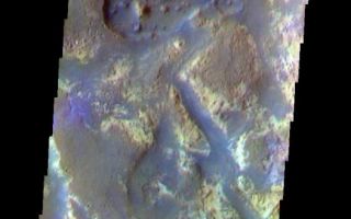 <h1>PIA07973:  Downstream in Mawrth Valles</h1><div class="PIA07973" lang="en" style="width:526px;text-align:left;margin:auto;background-color:#000;padding:10px;max-height:150px;overflow:auto;"><a href="/figures/PIA07973_fig1.jpg"></a><br /><p>The THEMIS VIS camera is capable of capturing color images of the Martian surface using five different color filters. In this mode of operation, the spatial resolution and coverage of the image must be reduced to accommodate the additional data volume produced from using multiple filters. To make a color image, three of the five filter images (each in grayscale) are selected. Each is contrast enhanced and then converted to a red, green, or blue intensity image. These three images are then combined to produce a full color, single image. Because the THEMIS color filters don't span the full range of colors seen by the human eye, a color THEMIS image does not represent true color. Also, because each single-filter image is contrast enhanced before inclusion in the three-color image, the apparent color variation of the scene is exaggerated. Nevertheless, the color variation that does appear is representative of some change in color, however subtle, in the actual scene. Note that the long edges of THEMIS color images typically contain color artifacts that do not represent surface variation.</p><p>This false color image is from further downstream in Mawrth Valles than yesterday's image. The channel here is at the end of the vallis. This image was collected during the Northern Spring season. </p><p>Image information: VIS instrument. Latitude 26.7, Longitude 340.2 East (19.8 West). 37 meter/pixel resolution.</p><p>Note: this THEMIS visual image has not been radiometrically nor geometrically calibrated for this preliminary release. An empirical correction has been performed to remove instrumental effects. A linear shift has been applied in the cross-track and down-track direction to approximate spacecraft and planetary motion. Fully calibrated and geometrically projected images will be released through the Planetary Data System in accordance with Project policies at a later time.</p><p>NASA's Jet Propulsion Laboratory manages the 2001 Mars Odyssey mission for NASA's Office of Space Science, Washington, D.C. The Thermal Emission Imaging System (THEMIS) was developed by Arizona State University, Tempe, in collaboration with Raytheon Santa Barbara Remote Sensing. The THEMIS investigation is led by Dr. Philip Christensen at Arizona State University. Lockheed Martin Astronautics, Denver, is the prime contractor for the Odyssey project, and developed and built the orbiter. Mission operations are conducted jointly from Lockheed Martin and from JPL, a division of the California Institute of Technology in Pasadena.</p><br /><br /><a href="http://photojournal.jpl.nasa.gov/catalog/PIA07973" onclick="window.open(this.href); return false;" title="Voir l'image 	 PIA07973:  Downstream in Mawrth Valles	  sur le site de la NASA">Voir l'image 	 PIA07973:  Downstream in Mawrth Valles	  sur le site de la NASA.</a></div>