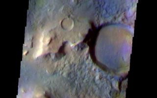 <h1>PIA07990:  Cratered Acidalia Planitia</h1><div class="PIA07990" lang="en" style="width:533px;text-align:left;margin:auto;background-color:#000;padding:10px;max-height:150px;overflow:auto;"><a href="/figures/PIA07990_fig1.jpg"></a><br /><p>The THEMIS VIS camera is capable of capturing color images of the Martian surface using five different color filters. In this mode of operation, the spatial resolution and coverage of the image must be reduced to accommodate the additional data volume produced from using multiple filters. To make a color image, three of the five filter images (each in grayscale) are selected. Each is contrast enhanced and then converted to a red, green, or blue intensity image. These three images are then combined to produce a full color, single image. Because the THEMIS color filters don't span the full range of colors seen by the human eye, a color THEMIS image does not represent true color. Also, because each single-filter image is contrast enhanced before inclusion in the three-color image, the apparent color variation of the scene is exaggerated. Nevertheless, the color variation that does appear is representative of some change in color, however subtle, in the actual scene. Note that the long edges of THEMIS color images typically contain color artifacts that do not represent surface variation.</p><p>This false color image shows a region with craters of different ages located at the margin of Acidalia Planitia. This iamge was collected during the Northern Spring season.</p><p>Image information: VIS instrument. Latitude 39.9, Longitude 350.4 East (9.6 West). 38 meter/pixel resolution.</p><p>Note: this THEMIS visual image has not been radiometrically nor geometrically calibrated for this preliminary release. An empirical correction has been performed to remove instrumental effects. A linear shift has been applied in the cross-track and down-track direction to approximate spacecraft and planetary motion. Fully calibrated and geometrically projected images will be released through the Planetary Data System in accordance with Project policies at a later time.</p><p>NASA's Jet Propulsion Laboratory manages the 2001 Mars Odyssey mission for NASA's Office of Space Science, Washington, D.C. The Thermal Emission Imaging System (THEMIS) was developed by Arizona State University, Tempe, in collaboration with Raytheon Santa Barbara Remote Sensing. The THEMIS investigation is led by Dr. Philip Christensen at Arizona State University. Lockheed Martin Astronautics, Denver, is the prime contractor for the Odyssey project, and developed and built the orbiter. Mission operations are conducted jointly from Lockheed Martin and from JPL, a division of the California Institute of Technology in Pasadena.</p><br /><br /><a href="http://photojournal.jpl.nasa.gov/catalog/PIA07990" onclick="window.open(this.href); return false;" title="Voir l'image 	 PIA07990:  Cratered Acidalia Planitia	  sur le site de la NASA">Voir l'image 	 PIA07990:  Cratered Acidalia Planitia	  sur le site de la NASA.</a></div>