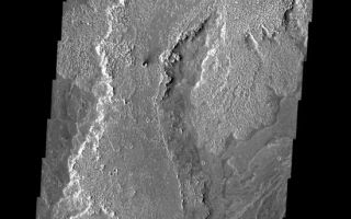 <h1>PIA08023:  Lava Flows</h1><div class="PIA08023" lang="en" style="width:550px;text-align:left;margin:auto;background-color:#000;padding:10px;max-height:150px;overflow:auto;"><p><a href="/figures/PIA08023_fig1.jpg"></a><br><b>Context image for PIA08023<br />Lava Flows</b></p><p>These lava flows are part of the Arsia Mons volcanic complex.<p>Image information: VIS instrument. Latitude -23.4N, Longitude 241.4E. 17 meter/pixel resolution.</p><p>Please see the <a href="http://themis.asu.edu/terms" target="_blank">THEMIS Data Citation Note</a> for details on crediting THEMIS images. </p><p>Note: this THEMIS visual image has not been radiometrically nor geometrically calibrated for this preliminary release. An empirical correction has been performed to remove instrumental effects. A linear shift has been applied in the cross-track and down-track direction to approximate spacecraft and planetary motion. Fully calibrated and geometrically projected images will be released through the Planetary Data System in accordance with Project policies at a later time.</p><p>NASA's Jet Propulsion Laboratory manages the 2001 Mars Odyssey mission for NASA's Office of Space Science, Washington, D.C. The Thermal Emission Imaging System (THEMIS) was developed by Arizona State University, Tempe, in collaboration with Raytheon Santa Barbara Remote Sensing. The THEMIS investigation is led by Dr. Philip Christensen at Arizona State University. Lockheed Martin Astronautics, Denver, is the prime contractor for the Odyssey project, and developed and built the orbiter. Mission operations are conducted jointly from Lockheed Martin and from JPL, a division of the California Institute of Technology in Pasadena.</p><br /><br /><a href="http://photojournal.jpl.nasa.gov/catalog/PIA08023" onclick="window.open(this.href); return false;" title="Voir l'image 	 PIA08023:  Lava Flows	  sur le site de la NASA">Voir l'image 	 PIA08023:  Lava Flows	  sur le site de la NASA.</a></div>