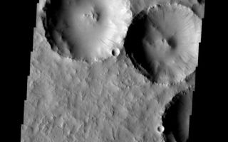 <h1>PIA08088:  Dust Slides</h1><div class="PIA08088" lang="en" style="width:572px;text-align:left;margin:auto;background-color:#000;padding:10px;max-height:150px;overflow:auto;"><p><a href="/figures/PIA08088_fig1.jpg"></a><br><b>Context image for PIA08088<br />Dust Slides</b></p><p>Dust slides occur within the larger craters in this image.<p>Image information: VIS instrument. Latitude 18.8N, Longitude 18.5E. 18 meter/pixel resolution.</p><p>Please see the <a href="http://themis.asu.edu/terms" target="_blank">THEMIS Data Citation Note</a> for details on crediting THEMIS images. </p><p>Note: this THEMIS visual image has not been radiometrically nor geometrically calibrated for this preliminary release. An empirical correction has been performed to remove instrumental effects. A linear shift has been applied in the cross-track and down-track direction to approximate spacecraft and planetary motion. Fully calibrated and geometrically projected images will be released through the Planetary Data System in accordance with Project policies at a later time.</p><p>NASA's Jet Propulsion Laboratory manages the 2001 Mars Odyssey mission for NASA's Office of Space Science, Washington, D.C. The Thermal Emission Imaging System (THEMIS) was developed by Arizona State University, Tempe, in collaboration with Raytheon Santa Barbara Remote Sensing. The THEMIS investigation is led by Dr. Philip Christensen at Arizona State University. Lockheed Martin Astronautics, Denver, is the prime contractor for the Odyssey project, and developed and built the orbiter. Mission operations are conducted jointly from Lockheed Martin and from JPL, a division of the California Institute of Technology in Pasadena.</p><br /><br /><a href="http://photojournal.jpl.nasa.gov/catalog/PIA08088" onclick="window.open(this.href); return false;" title="Voir l'image 	 PIA08088:  Dust Slides	  sur le site de la NASA">Voir l'image 	 PIA08088:  Dust Slides	  sur le site de la NASA.</a></div>