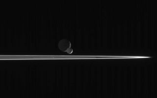 <h1>PIA08150:  Enceladus Races Onward</h1><div class="PIA08150" lang="en" style="width:800px;text-align:left;margin:auto;background-color:#000;padding:10px;max-height:150px;overflow:auto;"><p>As our robotic emissary to Saturn, the Cassini spacecraft is privileged to behold such fantastic sights as this pairing of two moons beyond the rings. The bright, narrow F ring is the outermost ring structure seen here.</p><p>In this scene, bright Enceladus (505 kilometers, or 314 miles across) begins to slip in front of more distant Dione (1,126 kilometers, or 700 miles across). Enceladus is closer to Saturn than Dione, and orbits the planet at greater velocity. Thus, the smaller moon eventually passed the larger one, as seen from the Cassini spacecraft, and continued on its way.</p><p>The image was taken with the Cassini spacecraft narrow-angle camera on March 3, 2006, using a filter sensitive to wavelengths of ultraviolet light centered at 338 nanometers and at a distance of approximately 2.6 million kilometers (1.6 million miles) from Enceladus and 2.7 million kilometers (1.7 million miles) from Dione. The view was taken from a phase angle (Sun-moon-spacecraft angle) of 139 degrees; about the same angle with respect to both moons. Image scale is about 16 kilometers (10 miles) per pixel on Enceladus and Dione.</p><p>The Cassini-Huygens mission is a cooperative project of NASA, the European Space Agency and the Italian Space Agency. The Jet Propulsion Laboratory, a division of the California Institute of Technology in Pasadena, manages the mission for NASA's Science Mission Directorate, Washington, D.C. The Cassini orbiter and its two onboard cameras were designed, developed and assembled at JPL. The imaging operations center is based at the Space Science Institute in Boulder, Colo.</p><p>For more information about the Cassini-Huygens mission visit <a href="http://saturn.jpl.nasa.gov">http://saturn.jpl.nasa.gov/home/index.cfm</a>. The Cassini imaging team homepage is at <a href="http://ciclops.org">http://ciclops.org</a>.</p><br /><br /><a href="http://photojournal.jpl.nasa.gov/catalog/PIA08150" onclick="window.open(this.href); return false;" title="Voir l'image 	 PIA08150:  Enceladus Races Onward	  sur le site de la NASA">Voir l'image 	 PIA08150:  Enceladus Races Onward	  sur le site de la NASA.</a></div>