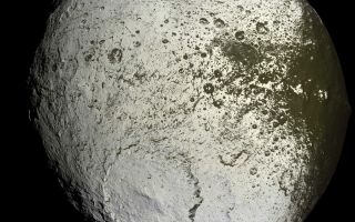 <h1>PIA08384:  The Other Side of Iapetus</h1><div class="PIA08384" lang="en" style="width:800px;text-align:left;margin:auto;background-color:#000;padding:10px;max-height:150px;overflow:auto;"><p>Cassini captures the first high-resolution glimpse of the bright trailing hemisphere of Saturn's moon Iapetus. </p><p>This false-color mosaic shows the entire hemisphere of Iapetus (1,468 kilometers, or 912 miles across) visible from Cassini on the outbound leg of its encounter with the two-toned moon in Sept. 2007. The central longitude of the trailing hemisphere is 24 degrees to the left of the mosaic's center. </p><p>Also shown here is the complicated transition region between the dark leading and bright trailing hemispheres. This region, visible along the right side of the image, was observed in many of the images acquired by Cassini near closest approach during the encounter.</p><p>Revealed here for the first time in detail are the geologic structures that mark the trailing hemisphere. The region appears heavily cratered, particularly in the north and south polar regions. Near the top of the mosaic, numerous impact features visible in NASA Voyager 2 spacecraft images (acquired in 1981) are visible, including the craters Ogier and Charlemagne.</p><p>The most prominent topographic feature in this view, in the bottom half of the mosaic, is a 450-kilometer (280-mile) wide impact basin, one of at least nine such large basins on Iapetus. In fact, the basin overlaps an older, similar-sized impact basin to its southeast.</p><p>In many places, the dark material--thought to be composed of nitrogen-bearing organic compounds called cyanides, hydrated minerals and other carbonaceous minerals--appears to coat equator-facing slopes and crater floors. The distribution of this material and variations in the color of the bright material across the trailing hemisphere will be crucial clues to understanding the origin of Iapetus' peculiar bright-dark dual personality.</p><p>The view was acquired with the Cassini spacecraft narrow-angle camera on Sept. 10, 2007, at a distance of about 73,000 kilometers (45,000 miles) from Iapetus.</p><p>The color seen in this view represents an expansion of the wavelengths of the electromagnetic spectrum visible to human eyes. The intense reddish-brown hue of the dark material is far less pronounced in true color images. The use of enhanced color makes the reddish character of the dark material more visible than it would be to the naked eye.</p><p>This mosaic consists of 60 images covering 15 footprints across the surface of Iapetus. The view is an orthographic projection centered on 10.8 degrees south latitude, 246.5 degrees west longitude and has a resolution of 426 meters (0.26 miles) per pixel. An orthographic view is most like the view seen by a distant observer looking through a telescope.</p><p>At each footprint, a full resolution clear filter image was combined with half-resolution images taken with infrared, green and ultraviolet spectral filters (centered at 752, 568 and 338 nanometers, respectively) to create this full-resolution false color mosaic.</p><p>The Cassini-Huygens mission is a cooperative project of NASA, the European Space Agency and the Italian Space Agency. The Jet Propulsion Laboratory, a division of the California Institute of Technology in Pasadena, manages the mission for NASA's Science Mission Directorate, Washington, D.C. The Cassini orbiter and its two onboard cameras were designed, developed and assembled at JPL. The imaging operations center is based at the Space Science Institute in Boulder, Colo.</p><p>For more information about the Cassini-Huygens mission visit <a href="http://saturn.jpl.nasa.gov">http://saturn.jpl.nasa.gov/home/index.cfm</a>. The Cassini imaging team homepage is at <a href="http://ciclops.org">http://ciclops.org</a>.</p><br /><br /><a href="http://photojournal.jpl.nasa.gov/catalog/PIA08384" onclick="window.open(this.href); return false;" title="Voir l'image 	 PIA08384:  The Other Side of Iapetus	  sur le site de la NASA">Voir l'image 	 PIA08384:  The Other Side of Iapetus	  sur le site de la NASA.</a></div>