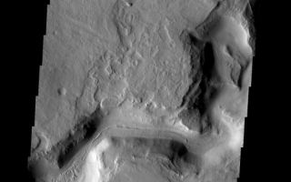 <h1>PIA08465:  Auqakuh Vallis</h1><div class="PIA08465" lang="en" style="width:583px;text-align:left;margin:auto;background-color:#000;padding:10px;max-height:150px;overflow:auto;"><p><a href="/figures/PIA08465_fig1.jpg"></a><br><b>Context image for PIA08465<br />Auqakuh Vallis</b></p><p>This image shows a portion of Auqakuh Vallis.<p>Image information: VIS instrument. Latitude 31.0N, Longitude 60.6E. 19 meter/pixel resolution.</p><p>Please see the <a href="http://themis.asu.edu/terms" target="_blank">THEMIS Data Citation Note</a> for details on crediting THEMIS images. </p><p>Note: this THEMIS visual image has not been radiometrically nor geometrically calibrated for this preliminary release. An empirical correction has been performed to remove instrumental effects. A linear shift has been applied in the cross-track and down-track direction to approximate spacecraft and planetary motion. Fully calibrated and geometrically projected images will be released through the Planetary Data System in accordance with Project policies at a later time.</p><p>NASA's Jet Propulsion Laboratory manages the 2001 Mars Odyssey mission for NASA's Office of Space Science, Washington, D.C. The Thermal Emission Imaging System (THEMIS) was developed by Arizona State University, Tempe, in collaboration with Raytheon Santa Barbara Remote Sensing. The THEMIS investigation is led by Dr. Philip Christensen at Arizona State University. Lockheed Martin Astronautics, Denver, is the prime contractor for the Odyssey project, and developed and built the orbiter. Mission operations are conducted jointly from Lockheed Martin and from JPL, a division of the California Institute of Technology in Pasadena.</p><br /><br /><a href="http://photojournal.jpl.nasa.gov/catalog/PIA08465" onclick="window.open(this.href); return false;" title="Voir l'image 	 PIA08465:  Auqakuh Vallis	  sur le site de la NASA">Voir l'image 	 PIA08465:  Auqakuh Vallis	  sur le site de la NASA.</a></div>