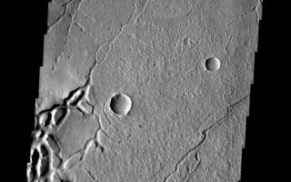<h1>PIA08474:  Arcuate Fractures</h1><div class="PIA08474" lang="en" style="width:556px;text-align:left;margin:auto;background-color:#000;padding:10px;max-height:150px;overflow:auto;"><p><a href="/figures/PIA08474_fig1.jpg"></a><br><b>Context image for PIA08474<br />Arcuate Fractures</b></p><p>These curved fractures are located on the margin between Memnonia Fossae and Elysium Planitia.<p>Image information: VIS instrument. Latitude -1.2N, Longitude 175.0E. 18 meter/pixel resolution.</p><p>Please see the <a href="http://themis.asu.edu/terms" target="_blank">THEMIS Data Citation Note</a> for details on crediting THEMIS images. </p><p>Note: this THEMIS visual image has not been radiometrically nor geometrically calibrated for this preliminary release. An empirical correction has been performed to remove instrumental effects. A linear shift has been applied in the cross-track and down-track direction to approximate spacecraft and planetary motion. Fully calibrated and geometrically projected images will be released through the Planetary Data System in accordance with Project policies at a later time.</p><p>NASA's Jet Propulsion Laboratory manages the 2001 Mars Odyssey mission for NASA's Office of Space Science, Washington, D.C. The Thermal Emission Imaging System (THEMIS) was developed by Arizona State University, Tempe, in collaboration with Raytheon Santa Barbara Remote Sensing. The THEMIS investigation is led by Dr. Philip Christensen at Arizona State University. Lockheed Martin Astronautics, Denver, is the prime contractor for the Odyssey project, and developed and built the orbiter. Mission operations are conducted jointly from Lockheed Martin and from JPL, a division of the California Institute of Technology in Pasadena.</p><br /><br /><a href="http://photojournal.jpl.nasa.gov/catalog/PIA08474" onclick="window.open(this.href); return false;" title="Voir l'image 	 PIA08474:  Arcuate Fractures	  sur le site de la NASA">Voir l'image 	 PIA08474:  Arcuate Fractures	  sur le site de la NASA.</a></div>