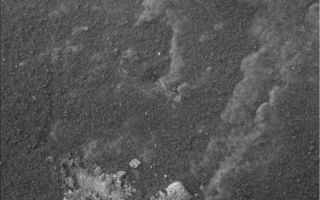 <h1>PIA08566:  Spirit Examines Light-Toned 'Halley' (Microscopic Image)</h1><div class="PIA08566" lang="en" style="width:800px;text-align:left;margin:auto;background-color:#000;padding:10px;max-height:150px;overflow:auto;"><p>Stretching along "Low Ridge" in front of the winter haven for NASA's Mars Exploration Rover Spirit are several continuous rock layers that make up the ridge. Some of these layers form fins that stick out from the other rocks in a way that suggests that they are resistant to erosion. Spirit is currently straddling one of these fin-like layers and can reach a small bit of light-toned material that might be a broken bit of it. Informally named "Halley," this rock was broken by Spirit's wheels when the rover drove over it.</p><p>Spirit's microscopic imager took this picture during the rover's 861st sol, or Martian day, of exploring Mars (June 5, 2006). The field of view is about 31 millimeters square (a square with sides of 1.2 inches). The light-toned soils in the bottom center and the top center of the image correspond to small, bright, bluish-white deposits just to the right of the rover's tracks in the lower left corner of an image from the panoramic camera (see <a href="/catalog/PIA08567">PIA08567</a>).</p><p>The first analyses of Halley showed it to be unusual in composition, containing a lot of the minor element zinc relative to the soil around it and having much of its iron tied up in the mineral hematite. When scientists again placed the scientific instruments on Spirit's robotic arm on a particularly bright-looking part of Halley, they found that the chemical composition of the bright spots was suggestive of a calcium sulfate mineral. Bright soils that Spirit has examined earlier in the mission contain iron sulfate.</p><p>This discovery raises new questions for the science team: Why is the sulfate mineralogy here different? Did Halley and the fin material form by water percolating through the layered rocks of Low Ridge? When did the chemical alteration of this rock occur? Spirit will continue to work on Halley and other light-toned materials along Low Ridge in the coming months to try to answer these questions.</p><br /><br /><a href="http://photojournal.jpl.nasa.gov/catalog/PIA08566" onclick="window.open(this.href); return false;" title="Voir l'image 	 PIA08566:  Spirit Examines Light-Toned 'Halley' (Microscopic Image)	  sur le site de la NASA">Voir l'image 	 PIA08566:  Spirit Examines Light-Toned 'Halley' (Microscopic Image)	  sur le site de la NASA.</a></div>