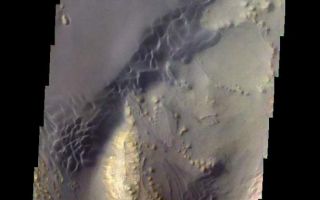 <h1>PIA08594:  Martian Color #10</h1><div class="PIA08594" lang="en" style="width:615px;text-align:left;margin:auto;background-color:#000;padding:10px;max-height:150px;overflow:auto;"><p><a href="/figures/PIA08594_fig1.jpg"></a><br><b>Context image for PIA08594<br />Martian Color #10</b></p><p>This image shows the sand dunes and layered material common on the floor of Valles Marineris.</p><p>This color treatment is the result of a collaboration between THEMIS team members at Cornell University and space artist Don Davis, who is an expert on true-color renderings of planetary and astronomical objects. Davis began with calibrated and co-registered THEMIS VIS multi-band radiance files produced by the Cornell group. Using as a guide true-color imaging from spacecraft and his own personal experience at Mt. Wilson and other observatories, he performed a manual color balance to display the spectral capabilities of the THEMIS imager within the context of other Mars observations. He also did some manual smoothing along with other image processing to minimize the effects of residual scattered light in the images.</p><p>Image information: VIS instrument. Latitude -6.7N, Longitude 310.8E. 35 meter/pixel resolution.</p><p>Please see the <a href="http://themis.asu.edu/terms" target="_blank">THEMIS Data Citation Note</a> for details on crediting THEMIS images. </p><p>Note: this THEMIS visual image has not been radiometrically nor geometrically calibrated for this preliminary release. An empirical correction has been performed to remove instrumental effects. A linear shift has been applied in the cross-track and down-track direction to approximate spacecraft and planetary motion. Fully calibrated and geometrically projected images will be released through the Planetary Data System in accordance with Project policies at a later time.</p><p>NASA's Jet Propulsion Laboratory manages the 2001 Mars Odyssey mission for NASA's Office of Space Science, Washington, D.C. The Thermal Emission Imaging System (THEMIS) was developed by Arizona State University, Tempe, in collaboration with Raytheon Santa Barbara Remote Sensing. The THEMIS investigation is led by Dr. Philip Christensen at Arizona State University. Lockheed Martin Astronautics, Denver, is the prime contractor for the Odyssey project, and developed and built the orbiter. Mission operations are conducted jointly from Lockheed Martin and from JPL, a division of the California Institute of Technology in Pasadena.</p><br /><br /><a href="http://photojournal.jpl.nasa.gov/catalog/PIA08594" onclick="window.open(this.href); return false;" title="Voir l'image 	 PIA08594:  Martian Color #10	  sur le site de la NASA">Voir l'image 	 PIA08594:  Martian Color #10	  sur le site de la NASA.</a></div>