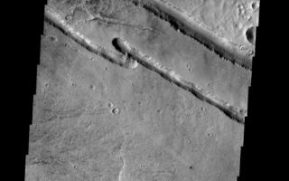 <h1>PIA08622:  Linear Fractures</h1><div class="PIA08622" lang="en" style="width:587px;text-align:left;margin:auto;background-color:#000;padding:10px;max-height:150px;overflow:auto;"><p><a href="/figures/PIA08622_fig1.jpg"></a><br><b>Context image for PIA08622<br />Linear Fractures</b></p><p>These linear fractures are part of Panchaia Rupes.</p><p>Image information: VIS instrument. Latitude 29.9N, Longitude 138.5E. 19 meter/pixel resolution.</p><p>Please see the <a href="http://themis.asu.edu/terms" target="_blank">THEMIS Data Citation Note</a> for details on crediting THEMIS images. </p><p>Note: this THEMIS visual image has not been radiometrically nor geometrically calibrated for this preliminary release. An empirical correction has been performed to remove instrumental effects. A linear shift has been applied in the cross-track and down-track direction to approximate spacecraft and planetary motion. Fully calibrated and geometrically projected images will be released through the Planetary Data System in accordance with Project policies at a later time.</p><p>NASA's Jet Propulsion Laboratory manages the 2001 Mars Odyssey mission for NASA's Office of Space Science, Washington, D.C. The Thermal Emission Imaging System (THEMIS) was developed by Arizona State University, Tempe, in collaboration with Raytheon Santa Barbara Remote Sensing. The THEMIS investigation is led by Dr. Philip Christensen at Arizona State University. Lockheed Martin Astronautics, Denver, is the prime contractor for the Odyssey project, and developed and built the orbiter. Mission operations are conducted jointly from Lockheed Martin and from JPL, a division of the California Institute of Technology in Pasadena.</p><br /><br /><a href="http://photojournal.jpl.nasa.gov/catalog/PIA08622" onclick="window.open(this.href); return false;" title="Voir l'image 	 PIA08622:  Linear Fractures	  sur le site de la NASA">Voir l'image 	 PIA08622:  Linear Fractures	  sur le site de la NASA.</a></div>