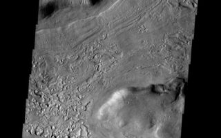 <h1>PIA08640:  Reull Vallis</h1><div class="PIA08640" lang="en" style="width:545px;text-align:left;margin:auto;background-color:#000;padding:10px;max-height:150px;overflow:auto;"><p><a href="/figures/PIA08640_fig1.jpg"></a><br><b>Context image for PIA08640<br />Reull Vallis</b></p><p>The floor of Reull Vallis is filled with patterned material. The patterns indicate a volitile such as ice played a part in creating the interesting surface.</p><p>Image information: VIS instrument. Latitude -40.3N, Longitude 109.1E. 17 meter/pixel resolution.</p><p>Please see the <a href="http://themis.asu.edu/terms" target="_blank">THEMIS Data Citation Note</a> for details on crediting THEMIS images. </p><p>Note: this THEMIS visual image has not been radiometrically nor geometrically calibrated for this preliminary release. An empirical correction has been performed to remove instrumental effects. A linear shift has been applied in the cross-track and down-track direction to approximate spacecraft and planetary motion. Fully calibrated and geometrically projected images will be released through the Planetary Data System in accordance with Project policies at a later time.</p><p>NASA's Jet Propulsion Laboratory manages the 2001 Mars Odyssey mission for NASA's Office of Space Science, Washington, D.C. The Thermal Emission Imaging System (THEMIS) was developed by Arizona State University, Tempe, in collaboration with Raytheon Santa Barbara Remote Sensing. The THEMIS investigation is led by Dr. Philip Christensen at Arizona State University. Lockheed Martin Astronautics, Denver, is the prime contractor for the Odyssey project, and developed and built the orbiter. Mission operations are conducted jointly from Lockheed Martin and from JPL, a division of the California Institute of Technology in Pasadena.</p><br /><br /><a href="http://photojournal.jpl.nasa.gov/catalog/PIA08640" onclick="window.open(this.href); return false;" title="Voir l'image 	 PIA08640:  Reull Vallis	  sur le site de la NASA">Voir l'image 	 PIA08640:  Reull Vallis	  sur le site de la NASA.</a></div>