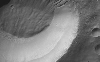 <h1>PIA08668:  Weepy Crater</h1><div class="PIA08668" lang="en" style="width:512px;text-align:left;margin:auto;background-color:#000;padding:10px;max-height:150px;overflow:auto;"><p>11 August 2006<br />This Mars Global Surveyor (MGS) Mars Orbiter Camera (MOC) image shows gullies -- all of which head at the same level -- on a south mid-latitude crater wall. At the 6 meters (~20 feet) per pixel scale at which this image was obtained, the gullies almost appear as if they are the product of a "weeping layer," a porous layer of rock through which a liquid such as water may have percolated until it came to the martian surface at this crater wall, then flowed downslope, toward the crater floor.</p><p>Location near: 34.0°S, 208.4°W <br />Image width: ~3 km (~1.9 mi) <br />Illumination from: upper left <br />Season: Southern Autumn </p><br /><br /><a href="http://photojournal.jpl.nasa.gov/catalog/PIA08668" onclick="window.open(this.href); return false;" title="Voir l'image 	 PIA08668:  Weepy Crater	  sur le site de la NASA">Voir l'image 	 PIA08668:  Weepy Crater	  sur le site de la NASA.</a></div>