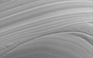 <h1>PIA08670:  Polar Exposure</h1><div class="PIA08670" lang="en" style="width:688px;text-align:left;margin:auto;background-color:#000;padding:10px;max-height:150px;overflow:auto;"><p>14 August 2006<br />This Mars Global Surveyor (MGS) Mars Orbiter Camera (MOC) image shows an unconformity in a sequence of layered material in the martian north polar region. MGS MOC has been examining many similar examples of unconformities created by erosion in the polar region this year. Long ago, the lower set of layers was deposited. Then, deposition ceased, and erosion occurred for some period. Then, the erosional period ended, and new layers were deposited. The older layers -- the ones deposited before the erosive event -- today appear truncated by the younger, more evenly-bedded layers. No one is certain what composes the north polar layers; they may be sequences of dust and ice.</p><p>Location near: 84.3°N, 235.6°W <br />Image width: ~3 km (~1.9 mi) <br />Illumination from: lower left <br />Season: Northern Spring </p><br /><br /><a href="http://photojournal.jpl.nasa.gov/catalog/PIA08670" onclick="window.open(this.href); return false;" title="Voir l'image 	 PIA08670:  Polar Exposure	  sur le site de la NASA">Voir l'image 	 PIA08670:  Polar Exposure	  sur le site de la NASA.</a></div>