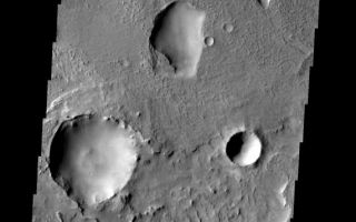 <h1>PIA08680:  Unusual Pits</h1><div class="PIA08680" lang="en" style="width:571px;text-align:left;margin:auto;background-color:#000;padding:10px;max-height:150px;overflow:auto;"><p><a href="/figures/PIA08680_fig1.jpg"></a><br><b>Context image for PIA08680<br />Unusual Pits></b></p><p>These odd shaped pits occur on the floor of a large crater in Terra Sabaea.</p><p>Image information: VIS instrument. Latitude 22.1N, Longitude 53.2E. 18 meter/pixel resolution.</p><p>Please see the <a href="http://themis.asu.edu/terms" target="_blank">THEMIS Data Citation Note</a> for details on crediting THEMIS images. </p><p>Note: this THEMIS visual image has not been radiometrically nor geometrically calibrated for this preliminary release. An empirical correction has been performed to remove instrumental effects. A linear shift has been applied in the cross-track and down-track direction to approximate spacecraft and planetary motion. Fully calibrated and geometrically projected images will be released through the Planetary Data System in accordance with Project policies at a later time.</p><p>NASA's Jet Propulsion Laboratory manages the 2001 Mars Odyssey mission for NASA's Office of Space Science, Washington, D.C. The Thermal Emission Imaging System (THEMIS) was developed by Arizona State University, Tempe, in collaboration with Raytheon Santa Barbara Remote Sensing. The THEMIS investigation is led by Dr. Philip Christensen at Arizona State University. Lockheed Martin Astronautics, Denver, is the prime contractor for the Odyssey project, and developed and built the orbiter. Mission operations are conducted jointly from Lockheed Martin and from JPL, a division of the California Institute of Technology in Pasadena.</p><br /><br /><a href="http://photojournal.jpl.nasa.gov/catalog/PIA08680" onclick="window.open(this.href); return false;" title="Voir l'image 	 PIA08680:  Unusual Pits	  sur le site de la NASA">Voir l'image 	 PIA08680:  Unusual Pits	  sur le site de la NASA.</a></div>
