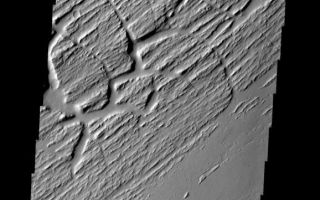 <h1>PIA08686:  Grooves and Cracks</h1><div class="PIA08686" lang="en" style="width:578px;text-align:left;margin:auto;background-color:#000;padding:10px;max-height:150px;overflow:auto;"><p><a href="/figures/PIA08686_fig1.jpg"></a><br><b>Context image for PIA08686<br />Grooves and Cracks></b></p><p>This image shows part of Sacra Sulci, a region of high standing grooves, crosscut by cracks and fractures. Lava flows are present to the south and sand dunes fill the floor of the large cracks.</p><p>Image information: VIS instrument. Latitude 22.1N, Longitude 285.1E. 18 meter/pixel resolution.</p><p>Please see the <a href="http://themis.asu.edu/terms" target="_blank">THEMIS Data Citation Note</a> for details on crediting THEMIS images. </p><p>Note: this THEMIS visual image has not been radiometrically nor geometrically calibrated for this preliminary release. An empirical correction has been performed to remove instrumental effects. A linear shift has been applied in the cross-track and down-track direction to approximate spacecraft and planetary motion. Fully calibrated and geometrically projected images will be released through the Planetary Data System in accordance with Project policies at a later time.</p><p>NASA's Jet Propulsion Laboratory manages the 2001 Mars Odyssey mission for NASA's Office of Space Science, Washington, D.C. The Thermal Emission Imaging System (THEMIS) was developed by Arizona State University, Tempe, in collaboration with Raytheon Santa Barbara Remote Sensing. The THEMIS investigation is led by Dr. Philip Christensen at Arizona State University. Lockheed Martin Astronautics, Denver, is the prime contractor for the Odyssey project, and developed and built the orbiter. Mission operations are conducted jointly from Lockheed Martin and from JPL, a division of the California Institute of Technology in Pasadena.</p><br /><br /><a href="http://photojournal.jpl.nasa.gov/catalog/PIA08686" onclick="window.open(this.href); return false;" title="Voir l'image 	 PIA08686:  Grooves and Cracks	  sur le site de la NASA">Voir l'image 	 PIA08686:  Grooves and Cracks	  sur le site de la NASA.</a></div>