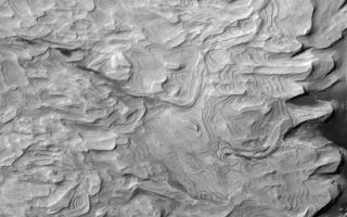 <h1>PIA08702:  Many-Layered Rock</h1><div class="PIA08702" lang="en" style="width:548px;text-align:left;margin:auto;background-color:#000;padding:10px;max-height:150px;overflow:auto;"><p>23 August 2006<br />This Mars Global Surveyor (MGS) Mars Orbiter Camera (MOC) image shows light-toned, layered, sedimentary rocks in a crater in the northwestern part of Schiaparelli basin. The repetition of these horizontal layers suggests the sediments could have been deposited in an ancient crater lake.</p><p>Location near: 0.3°S, 345.6°W <br />Image width: ~3 km (~1.9 mi) <br />Illumination from: upper left <br />Season: Southern Autumn </p><br /><br /><a href="http://photojournal.jpl.nasa.gov/catalog/PIA08702" onclick="window.open(this.href); return false;" title="Voir l'image 	 PIA08702:  Many-Layered Rock	  sur le site de la NASA">Voir l'image 	 PIA08702:  Many-Layered Rock	  sur le site de la NASA.</a></div>