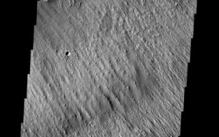 <h1>PIA08707:  Yardangs</h1><div class="PIA08707" lang="en" style="width:552px;text-align:left;margin:auto;background-color:#000;padding:10px;max-height:150px;overflow:auto;"><p><a href="/figures/PIA08705_fig1.jpg"></a><br><b>Context image for PIA08705<br />Yardangs</b></p><p>Wind action in the Medusae Fossae region is creating yardangs in the easily eroded material.</p><p>Image information: VIS instrument. Latitude -10.2N, Longitude 182.6E. 18 meter/pixel resolution.</p><p>Please see the <a href="http://themis.asu.edu/terms" target="_blank">THEMIS Data Citation Note</a> for details on crediting THEMIS images.</p><p>Note: this THEMIS visual image has not been radiometrically nor geometrically calibrated for this preliminary release. An empirical correction has been performed to remove instrumental effects. A linear shift has been applied in the cross-track and down-track direction to approximate spacecraft and planetary motion. Fully calibrated and geometrically projected images will be released through the Planetary Data System in accordance with Project policies at a later time.</p><p>NASA's Jet Propulsion Laboratory manages the 2001 Mars Odyssey mission for NASA's Office of Space Science, Washington, D.C. The Thermal Emission Imaging System (THEMIS) was developed by Arizona State University, Tempe, in collaboration with Raytheon Santa Barbara Remote Sensing. The THEMIS investigation is led by Dr. Philip Christensen at Arizona State University. Lockheed Martin Astronautics, Denver, is the prime contractor for the Odyssey project, and developed and built the orbiter. Mission operations are conducted jointly from Lockheed Martin and from JPL, a division of the California Institute of Technology in Pasadena.</p><br /><br /><a href="http://photojournal.jpl.nasa.gov/catalog/PIA08707" onclick="window.open(this.href); return false;" title="Voir l'image 	 PIA08707:  Yardangs	  sur le site de la NASA">Voir l'image 	 PIA08707:  Yardangs	  sur le site de la NASA.</a></div>