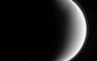 <h1>PIA08868:  Bands of Titan</h1><div class="PIA08868" lang="en" style="width:800px;text-align:left;margin:auto;background-color:#000;padding:10px;max-height:150px;overflow:auto;"><p>Titan bears a distinct east-west banded pattern in this Cassini spacecraft image taken in the ultraviolet.</p><p>The ultraviolet wavelength allows Cassini to see Titan's stratosphere, where superrotation--in which the atmosphere moves around the moon faster than Titan rotates -- is strong. The recent appearance of this feature may be a harbinger of seasonal change on Titan.</p><p>The moon's halo -- its detached, high-altitude global haze layer -- is visible here as well, and is often its most prominent feature in such ultraviolet views.</p><p>North on Titan (5,150 kilometers, 3,200 miles across) is up and rotated 6 degrees to the right in this image.</p><p>The view was obtained by the Cassini spacecraft narrow-angle camera using a spectral filter sensitive to wavelengths of polarized ultraviolet light. The view was acquired on Dec. 25, 2006 at a distance of approximately 1.3 million kilometers (800,000 miles) from Titan and at a Sun-Titan-spacecraft, or phase, angle of 123 degrees. Image scale is 8 kilometers (5 miles) per pixel.</p><p>The Cassini-Huygens mission is a cooperative project of NASA, the European Space Agency and the Italian Space Agency. The Jet Propulsion Laboratory, a division of the California Institute of Technology in Pasadena, manages the mission for NASA's Science Mission Directorate, Washington, D.C. The Cassini orbiter and its two onboard cameras were designed, developed and assembled at JPL. The imaging operations center is based at the Space Science Institute in Boulder, Colo.</p><p>For more information about the Cassini-Huygens mission visit <a href="http://saturn.jpl.nasa.gov">http://saturn.jpl.nasa.gov/home/index.cfm</a>. The Cassini imaging team homepage is at <a href="http://ciclops.org">http://ciclops.org</a>.</p><br /><br /><a href="http://photojournal.jpl.nasa.gov/catalog/PIA08868" onclick="window.open(this.href); return false;" title="Voir l'image 	 PIA08868:  Bands of Titan	  sur le site de la NASA">Voir l'image 	 PIA08868:  Bands of Titan	  sur le site de la NASA.</a></div>