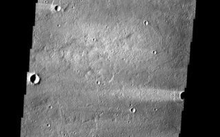 <h1>PIA09050:  Windstreak</h1><div class="PIA09050" lang="en" style="width:582px;text-align:left;margin:auto;background-color:#000;padding:10px;max-height:150px;overflow:auto;"><p><a href="/figures/PIA09050_fig1.jpg"></a><br><b>Context image for PIA09050<br />Windstreak</b></p><p>The windstreaks in this image are located on Tharsis volcanic flows northeast of Olympus Mons.<p>Image information: VIS instrument. Latitude 32.0N, Longitude 234.5E. 19 meter/pixel resolution.</p><p>Please see the <a href="http://themis.asu.edu/terms" target="_blank">THEMIS Data Citation Note</a> for details on crediting THEMIS images.</p><p>Note: this THEMIS visual image has not been radiometrically nor geometrically calibrated for this preliminary release. An empirical correction has been performed to remove instrumental effects. A linear shift has been applied in the cross-track and down-track direction to approximate spacecraft and planetary motion. Fully calibrated and geometrically projected images will be released through the Planetary Data System in accordance with Project policies at a later time.</p><p>NASA's Jet Propulsion Laboratory manages the 2001 Mars Odyssey mission for NASA's Office of Space Science, Washington, D.C. The Thermal Emission Imaging System (THEMIS) was developed by Arizona State University, Tempe, in collaboration with Raytheon Santa Barbara Remote Sensing. The THEMIS investigation is led by Dr. Philip Christensen at Arizona State University. Lockheed Martin Astronautics, Denver, is the prime contractor for the Odyssey project, and developed and built the orbiter. Mission operations are conducted jointly from Lockheed Martin and from JPL, a division of the California Institute of Technology in Pasadena.</p><br /><br /><a href="http://photojournal.jpl.nasa.gov/catalog/PIA09050" onclick="window.open(this.href); return false;" title="Voir l'image 	 PIA09050:  Windstreak	  sur le site de la NASA">Voir l'image 	 PIA09050:  Windstreak	  sur le site de la NASA.</a></div>