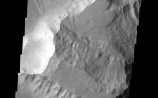 <h1>PIA09059:  Landslide</h1><div class="PIA09059" lang="en" style="width:527px;text-align:left;margin:auto;background-color:#000;padding:10px;max-height:150px;overflow:auto;"><p><a href="/figures/PIA09059_fig1.jpg"></a><br><b>Context image for PIA09059<br />Landslide</b></p><p>This image of Tiu Vallis shows a landslide that crossed the entire width of the channel.<p>Image information: VIS instrument. Latitude 4.4N, Longitude 326.9E. 18 meter/pixel resolution.</p><p>Please see the <a href="http://themis.asu.edu/terms" target="_blank">THEMIS Data Citation Note</a> for details on crediting THEMIS images.</p><p>Note: this THEMIS visual image has not been radiometrically nor geometrically calibrated for this preliminary release. An empirical correction has been performed to remove instrumental effects. A linear shift has been applied in the cross-track and down-track direction to approximate spacecraft and planetary motion. Fully calibrated and geometrically projected images will be released through the Planetary Data System in accordance with Project policies at a later time.</p><p>NASA's Jet Propulsion Laboratory manages the 2001 Mars Odyssey mission for NASA's Office of Space Science, Washington, D.C. The Thermal Emission Imaging System (THEMIS) was developed by Arizona State University, Tempe, in collaboration with Raytheon Santa Barbara Remote Sensing. The THEMIS investigation is led by Dr. Philip Christensen at Arizona State University. Lockheed Martin Astronautics, Denver, is the prime contractor for the Odyssey project, and developed and built the orbiter. Mission operations are conducted jointly from Lockheed Martin and from JPL, a division of the California Institute of Technology in Pasadena.</p><br /><br /><a href="http://photojournal.jpl.nasa.gov/catalog/PIA09059" onclick="window.open(this.href); return false;" title="Voir l'image 	 PIA09059:  Landslide	  sur le site de la NASA">Voir l'image 	 PIA09059:  Landslide	  sur le site de la NASA.</a></div>