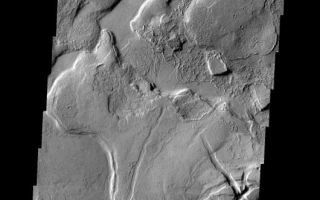 <h1>PIA09069:  Tharsis</h1><div class="PIA09069" lang="en" style="width:530px;text-align:left;margin:auto;background-color:#000;padding:10px;max-height:150px;overflow:auto;"><p><a href="/figures/PIA09069_fig1.jpg"></a><br><b>Context image for PIA09069<br />Tharsis</b></p><p>This complex region of lava flows and fracturing is located at the eastern margin of the Tharsis Volcanic Complex.<p>Image information: VIS instrument. Latitude 10.1N, Longitude 282.0E. 18 meter/pixel resolution.</p><p>Please see the <a href="http://themis.asu.edu/terms" target="_blank">THEMIS Data Citation Note</a> for details on crediting THEMIS images.</p><p>Note: this THEMIS visual image has not been radiometrically nor geometrically calibrated for this preliminary release. An empirical correction has been performed to remove instrumental effects. A linear shift has been applied in the cross-track and down-track direction to approximate spacecraft and planetary motion. Fully calibrated and geometrically projected images will be released through the Planetary Data System in accordance with Project policies at a later time.</p><p>NASA's Jet Propulsion Laboratory manages the 2001 Mars Odyssey mission for NASA's Office of Space Science, Washington, D.C. The Thermal Emission Imaging System (THEMIS) was developed by Arizona State University, Tempe, in collaboration with Raytheon Santa Barbara Remote Sensing. The THEMIS investigation is led by Dr. Philip Christensen at Arizona State University. Lockheed Martin Astronautics, Denver, is the prime contractor for the Odyssey project, and developed and built the orbiter. Mission operations are conducted jointly from Lockheed Martin and from JPL, a division of the California Institute of Technology in Pasadena.</p><br /><br /><a href="http://photojournal.jpl.nasa.gov/catalog/PIA09069" onclick="window.open(this.href); return false;" title="Voir l'image 	 PIA09069:  Tharsis	  sur le site de la NASA">Voir l'image 	 PIA09069:  Tharsis	  sur le site de la NASA.</a></div>