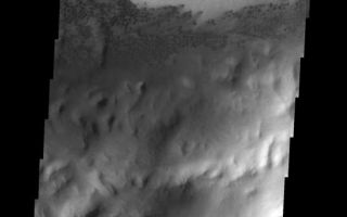 <h1>PIA09121:  Sand Dunes</h1><div class="PIA09121" lang="en" style="width:536px;text-align:left;margin:auto;background-color:#000;padding:10px;max-height:150px;overflow:auto;"><p><a href="/figures/PIA09121_fig1.jpg"></a><br><b>Context image for PIA09121<br />Sand Dunes</b></p><p>An extensive field of small, dark dunes in located on the floor of the unnamed crater in Arabia Terra.<p>Image information: VIS instrument. Latitude 12.5N, Longitude 353.0E. 18 meter/pixel resolution.</p><p>Please see the <a href="http://themis.asu.edu/terms" target="_blank">THEMIS Data Citation Note</a> for details on crediting THEMIS images.</p><p>Note: this THEMIS visual image has not been radiometrically nor geometrically calibrated for this preliminary release. An empirical correction has been performed to remove instrumental effects. A linear shift has been applied in the cross-track and down-track direction to approximate spacecraft and planetary motion. Fully calibrated and geometrically projected images will be released through the Planetary Data System in accordance with Project policies at a later time.</p><p>NASA's Jet Propulsion Laboratory manages the 2001 Mars Odyssey mission for NASA's Office of Space Science, Washington, D.C. The Thermal Emission Imaging System (THEMIS) was developed by Arizona State University, Tempe, in collaboration with Raytheon Santa Barbara Remote Sensing. The THEMIS investigation is led by Dr. Philip Christensen at Arizona State University. Lockheed Martin Astronautics, Denver, is the prime contractor for the Odyssey project, and developed and built the orbiter. Mission operations are conducted jointly from Lockheed Martin and from JPL, a division of the California Institute of Technology in Pasadena.</p><br /><br /><a href="http://photojournal.jpl.nasa.gov/catalog/PIA09121" onclick="window.open(this.href); return false;" title="Voir l'image 	 PIA09121:  Sand Dunes	  sur le site de la NASA">Voir l'image 	 PIA09121:  Sand Dunes	  sur le site de la NASA.</a></div>