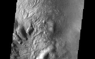 <h1>PIA09124:  Dunes & Swirls</h1><div class="PIA09124" lang="en" style="width:535px;text-align:left;margin:auto;background-color:#000;padding:10px;max-height:150px;overflow:auto;"><p><a href="/figures/PIA09124_fig1.jpg"></a><br><b>Context image for PIA09124<br /> Dunes & Swirls</b></p><p>This unnamed northern crater contains several dune fields. Within the central peak region (left side of image) there is material with a "swirled" surface pattern/texture. This type of texture indicates that volitiles may exist within the material.<p>Image information: VIS instrument. Latitude 41.8N, Longitude 44.8E. 38 meter/pixel resolution.</p><p>Please see the <a href="http://themis.asu.edu/terms" target="_blank">THEMIS Data Citation Note</a> for details on crediting THEMIS images.</p><p>Note: this THEMIS visual image has not been radiometrically nor geometrically calibrated for this preliminary release. An empirical correction has been performed to remove instrumental effects. A linear shift has been applied in the cross-track and down-track direction to approximate spacecraft and planetary motion. Fully calibrated and geometrically projected images will be released through the Planetary Data System in accordance with Project policies at a later time.</p><p>NASA's Jet Propulsion Laboratory manages the 2001 Mars Odyssey mission for NASA's Office of Space Science, Washington, D.C. The Thermal Emission Imaging System (THEMIS) was developed by Arizona State University, Tempe, in collaboration with Raytheon Santa Barbara Remote Sensing. The THEMIS investigation is led by Dr. Philip Christensen at Arizona State University. Lockheed Martin Astronautics, Denver, is the prime contractor for the Odyssey project, and developed and built the orbiter. Mission operations are conducted jointly from Lockheed Martin and from JPL, a division of the California Institute of Technology in Pasadena.</p><br /><br /><a href="http://photojournal.jpl.nasa.gov/catalog/PIA09124" onclick="window.open(this.href); return false;" title="Voir l'image 	 PIA09124:  Dunes & Swirls	  sur le site de la NASA">Voir l'image 	 PIA09124:  Dunes & Swirls	  sur le site de la NASA.</a></div>