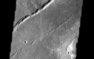 <h1>PIA09127:  Mareotis Fossae</h1><div class="PIA09127" lang="en" style="width:553px;text-align:left;margin:auto;background-color:#000;padding:10px;max-height:150px;overflow:auto;"><p><a href="/figures/PIA09127_fig1.jpg"></a><br><b>Context image for PIA09127<br /> Mareotis Fossae</b></p><p>These thin, parallel ridges appear to be narrow lava flows from Alba Patera. The large fracture is part of Mareotis Fossae.<p>Image information: VIS instrument. Latitude 34.9N, Longitude 272.7E. 19 meter/pixel resolution.</p><p>Please see the <a href="http://themis.asu.edu/terms" target="_blank">THEMIS Data Citation Note</a> for details on crediting THEMIS images.</p><p>Note: this THEMIS visual image has not been radiometrically nor geometrically calibrated for this preliminary release. An empirical correction has been performed to remove instrumental effects. A linear shift has been applied in the cross-track and down-track direction to approximate spacecraft and planetary motion. Fully calibrated and geometrically projected images will be released through the Planetary Data System in accordance with Project policies at a later time.</p><p>NASA's Jet Propulsion Laboratory manages the 2001 Mars Odyssey mission for NASA's Office of Space Science, Washington, D.C. The Thermal Emission Imaging System (THEMIS) was developed by Arizona State University, Tempe, in collaboration with Raytheon Santa Barbara Remote Sensing. The THEMIS investigation is led by Dr. Philip Christensen at Arizona State University. Lockheed Martin Astronautics, Denver, is the prime contractor for the Odyssey project, and developed and built the orbiter. Mission operations are conducted jointly from Lockheed Martin and from JPL, a division of the California Institute of Technology in Pasadena.</p><br /><br /><a href="http://photojournal.jpl.nasa.gov/catalog/PIA09127" onclick="window.open(this.href); return false;" title="Voir l'image 	 PIA09127:  Mareotis Fossae	  sur le site de la NASA">Voir l'image 	 PIA09127:  Mareotis Fossae	  sur le site de la NASA.</a></div>