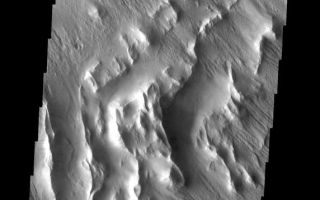 <h1>PIA09135:  Wind Erosion</h1><div class="PIA09135" lang="en" style="width:572px;text-align:left;margin:auto;background-color:#000;padding:10px;max-height:150px;overflow:auto;"><p><a href="/figures/PIA09135_fig1.jpg"></a><br><b>Context image for PIA09135<br /> Wind Erosion</b></p><p>These wind eroded hills are located on the southwest margin of Lycus Sulci.<p>Image information: VIS instrument. Latitude 15.9N, Longitude 214.8E. 18 meter/pixel resolution.</p><p>Please see the <a href="http://themis.asu.edu/terms" target="_blank">THEMIS Data Citation Note</a> for details on crediting THEMIS images.</p><p>Note: this THEMIS visual image has not been radiometrically nor geometrically calibrated for this preliminary release. An empirical correction has been performed to remove instrumental effects. A linear shift has been applied in the cross-track and down-track direction to approximate spacecraft and planetary motion. Fully calibrated and geometrically projected images will be released through the Planetary Data System in accordance with Project policies at a later time.</p><p>NASA's Jet Propulsion Laboratory manages the 2001 Mars Odyssey mission for NASA's Office of Space Science, Washington, D.C. The Thermal Emission Imaging System (THEMIS) was developed by Arizona State University, Tempe, in collaboration with Raytheon Santa Barbara Remote Sensing. The THEMIS investigation is led by Dr. Philip Christensen at Arizona State University. Lockheed Martin Astronautics, Denver, is the prime contractor for the Odyssey project, and developed and built the orbiter. Mission operations are conducted jointly from Lockheed Martin and from JPL, a division of the California Institute of Technology in Pasadena.</p><br /><br /><a href="http://photojournal.jpl.nasa.gov/catalog/PIA09135" onclick="window.open(this.href); return false;" title="Voir l'image 	 PIA09135:  Wind Erosion	  sur le site de la NASA">Voir l'image 	 PIA09135:  Wind Erosion	  sur le site de la NASA.</a></div>