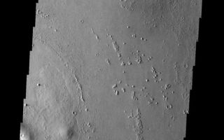 <h1>PIA09138:  Eroded Ejecta</h1><div class="PIA09138" lang="en" style="width:572px;text-align:left;margin:auto;background-color:#000;padding:10px;max-height:150px;overflow:auto;"><p><a href="/figures/PIA09138_fig1.jpg"></a><br><b>Context image for PIA09138<br /> Eroded Ejecta</b></p><p>This ejecta blanket surrounding this small unnamed crater on the margin of Eumenides Dorsum has steep margins created by erosion.<p>Image information: VIS instrument. Latitude 11.5N, Longitude 203.5E. 18 meter/pixel resolution.</p><p>Please see the <a href="http://themis.asu.edu/terms" target="_blank">THEMIS Data Citation Note</a> for details on crediting THEMIS images.</p><p>Note: this THEMIS visual image has not been radiometrically nor geometrically calibrated for this preliminary release. An empirical correction has been performed to remove instrumental effects. A linear shift has been applied in the cross-track and down-track direction to approximate spacecraft and planetary motion. Fully calibrated and geometrically projected images will be released through the Planetary Data System in accordance with Project policies at a later time.</p><p>NASA's Jet Propulsion Laboratory manages the 2001 Mars Odyssey mission for NASA's Office of Space Science, Washington, D.C. The Thermal Emission Imaging System (THEMIS) was developed by Arizona State University, Tempe, in collaboration with Raytheon Santa Barbara Remote Sensing. The THEMIS investigation is led by Dr. Philip Christensen at Arizona State University. Lockheed Martin Astronautics, Denver, is the prime contractor for the Odyssey project, and developed and built the orbiter. Mission operations are conducted jointly from Lockheed Martin and from JPL, a division of the California Institute of Technology in Pasadena.</p><br /><br /><a href="http://photojournal.jpl.nasa.gov/catalog/PIA09138" onclick="window.open(this.href); return false;" title="Voir l'image 	 PIA09138:  Eroded Ejecta	  sur le site de la NASA">Voir l'image 	 PIA09138:  Eroded Ejecta	  sur le site de la NASA.</a></div>