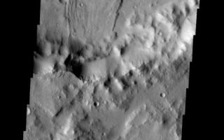 <h1>PIA09152:  Landslide</h1><div class="PIA09152" lang="en" style="width:522px;text-align:left;margin:auto;background-color:#000;padding:10px;max-height:150px;overflow:auto;"><p><a href="/figures/PIA09152_fig1.jpg"></a><br><b>Context image for PIA09152<br /> Landslide</b></p><p>This landslide is located in an unnamed crater in Tyrrhena Terra.<p>Image information: VIS instrument. Latitude 0.5N, Longitude 98.3E. 18 meter/pixel resolution.</p><p>Please see the <a href="http://themis.asu.edu/terms" target="_blank">THEMIS Data Citation Note</a> for details on crediting THEMIS images.</p><p>Note: this THEMIS visual image has not been radiometrically nor geometrically calibrated for this preliminary release. An empirical correction has been performed to remove instrumental effects. A linear shift has been applied in the cross-track and down-track direction to approximate spacecraft and planetary motion. Fully calibrated and geometrically projected images will be released through the Planetary Data System in accordance with Project policies at a later time.</p><p>NASA's Jet Propulsion Laboratory manages the 2001 Mars Odyssey mission for NASA's Office of Space Science, Washington, D.C. The Thermal Emission Imaging System (THEMIS) was developed by Arizona State University, Tempe, in collaboration with Raytheon Santa Barbara Remote Sensing. The THEMIS investigation is led by Dr. Philip Christensen at Arizona State University. Lockheed Martin Astronautics, Denver, is the prime contractor for the Odyssey project, and developed and built the orbiter. Mission operations are conducted jointly from Lockheed Martin and from JPL, a division of the California Institute of Technology in Pasadena.</p><br /><br /><a href="http://photojournal.jpl.nasa.gov/catalog/PIA09152" onclick="window.open(this.href); return false;" title="Voir l'image 	 PIA09152:  Landslide	  sur le site de la NASA">Voir l'image 	 PIA09152:  Landslide	  sur le site de la NASA.</a></div>