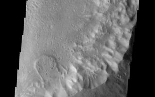 <h1>PIA09163:  Landslide</h1><div class="PIA09163" lang="en" style="width:551px;text-align:left;margin:auto;background-color:#000;padding:10px;max-height:150px;overflow:auto;"><p><a href="/figures/PIA09163_fig1.jpg"></a><br><b>Context image for PIA09163<br />Landslide</b></p><p>This small landslide is located in an unnamed crater.<p>Image information: VIS instrument. Latitude -26.0N, Longitude 344.4E. 18 meter/pixel resolution.</p><p>Please see the <a href="http://themis.asu.edu/terms" target="_blank">THEMIS Data Citation Note</a> for details on crediting THEMIS images.</p><p>Note: this THEMIS visual image has not been radiometrically nor geometrically calibrated for this preliminary release. An empirical correction has been performed to remove instrumental effects. A linear shift has been applied in the cross-track and down-track direction to approximate spacecraft and planetary motion. Fully calibrated and geometrically projected images will be released through the Planetary Data System in accordance with Project policies at a later time.</p><p>NASA's Jet Propulsion Laboratory manages the 2001 Mars Odyssey mission for NASA's Office of Space Science, Washington, D.C. The Thermal Emission Imaging System (THEMIS) was developed by Arizona State University, Tempe, in collaboration with Raytheon Santa Barbara Remote Sensing. The THEMIS investigation is led by Dr. Philip Christensen at Arizona State University. Lockheed Martin Astronautics, Denver, is the prime contractor for the Odyssey project, and developed and built the orbiter. Mission operations are conducted jointly from Lockheed Martin and from JPL, a division of the California Institute of Technology in Pasadena.</p><br /><br /><a href="http://photojournal.jpl.nasa.gov/catalog/PIA09163" onclick="window.open(this.href); return false;" title="Voir l'image 	 PIA09163:  Landslide	  sur le site de la NASA">Voir l'image 	 PIA09163:  Landslide	  sur le site de la NASA.</a></div>