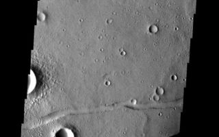 <h1>PIA09297:  Fractures</h1><div class="PIA09297" lang="en" style="width:548px;text-align:left;margin:auto;background-color:#000;padding:10px;max-height:150px;overflow:auto;"><p><a href="/figures/PIA09297_fig1.jpg"></a><br><b>Context image for PIA09297<br />Fractures</b></p><p>The fractures at the top of this image are part of Mangala Fossae. The fractures in the lower half are part of the Memnonia Fossae system.<p>Image information: VIS instrument. Latitude -20.5N, Longitude 205.2E. 17 meter/pixel resolution.</p><p>Please see the <a href="http://themis.asu.edu/terms" target="_blank">THEMIS Data Citation Note</a> for details on crediting THEMIS images.</p><p>Note: this THEMIS visual image has not been radiometrically nor geometrically calibrated for this preliminary release. An empirical correction has been performed to remove instrumental effects. A linear shift has been applied in the cross-track and down-track direction to approximate spacecraft and planetary motion. Fully calibrated and geometrically projected images will be released through the Planetary Data System in accordance with Project policies at a later time.</p><p>NASA's Jet Propulsion Laboratory manages the 2001 Mars Odyssey mission for NASA's Office of Space Science, Washington, D.C. The Thermal Emission Imaging System (THEMIS) was developed by Arizona State University, Tempe, in collaboration with Raytheon Santa Barbara Remote Sensing. The THEMIS investigation is led by Dr. Philip Christensen at Arizona State University. Lockheed Martin Astronautics, Denver, is the prime contractor for the Odyssey project, and developed and built the orbiter. Mission operations are conducted jointly from Lockheed Martin and from JPL, a division of the California Institute of Technology in Pasadena.</p><br /><br /><a href="http://photojournal.jpl.nasa.gov/catalog/PIA09297" onclick="window.open(this.href); return false;" title="Voir l'image 	 PIA09297:  Fractures	  sur le site de la NASA">Voir l'image 	 PIA09297:  Fractures	  sur le site de la NASA.</a></div>