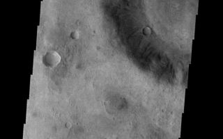 <h1>PIA09299:  Dunes on the Move</h1><div class="PIA09299" lang="en" style="width:555px;text-align:left;margin:auto;background-color:#000;padding:10px;max-height:150px;overflow:auto;"><p><a href="/figures/PIA09299_fig1.jpg"></a><br><b>Context image for PIA09299<br />Dunes on the Move</b></p><p>These small, dark dunes in Ruza Crater are moving from the crater floor to the crater rim. With the passage of time and continued wind activity the leading dunes will exit the crater completely.<p>Image information: VIS instrument. Latitude -34.1N, Longitude 307.1E. 17 meter/pixel resolution.</p><p>Please see the <a href="http://themis.asu.edu/terms" target="_blank">THEMIS Data Citation Note</a> for details on crediting THEMIS images.</p><p>Note: this THEMIS visual image has not been radiometrically nor geometrically calibrated for this preliminary release. An empirical correction has been performed to remove instrumental effects. A linear shift has been applied in the cross-track and down-track direction to approximate spacecraft and planetary motion. Fully calibrated and geometrically projected images will be released through the Planetary Data System in accordance with Project policies at a later time.</p><p>NASA's Jet Propulsion Laboratory manages the 2001 Mars Odyssey mission for NASA's Office of Space Science, Washington, D.C. The Thermal Emission Imaging System (THEMIS) was developed by Arizona State University, Tempe, in collaboration with Raytheon Santa Barbara Remote Sensing. The THEMIS investigation is led by Dr. Philip Christensen at Arizona State University. Lockheed Martin Astronautics, Denver, is the prime contractor for the Odyssey project, and developed and built the orbiter. Mission operations are conducted jointly from Lockheed Martin and from JPL, a division of the California Institute of Technology in Pasadena.</p><br /><br /><a href="http://photojournal.jpl.nasa.gov/catalog/PIA09299" onclick="window.open(this.href); return false;" title="Voir l'image 	 PIA09299:  Dunes on the Move	  sur le site de la NASA">Voir l'image 	 PIA09299:  Dunes on the Move	  sur le site de la NASA.</a></div>